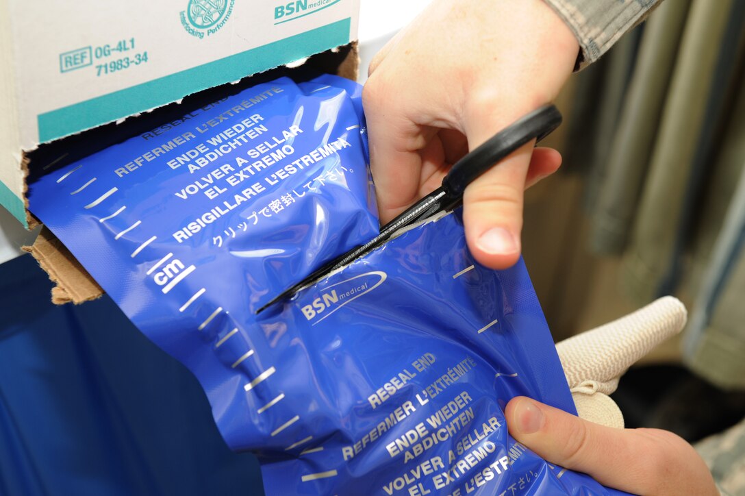 U.S. Air Force Staff Sgt. Christopher Leonard, a paramedic assigned to the 633rd Medical Operations Squadron, cuts Ortho-glass to use as a splint for training purposes at Langley Air Force Base, Va., March 7, 2016. Ortho-glass, a modern way of splinting a fracture, is padded which helps cut down on the application time. (U.S. Air Force photo by Senior Airman Brittany E. N. Murphy)
