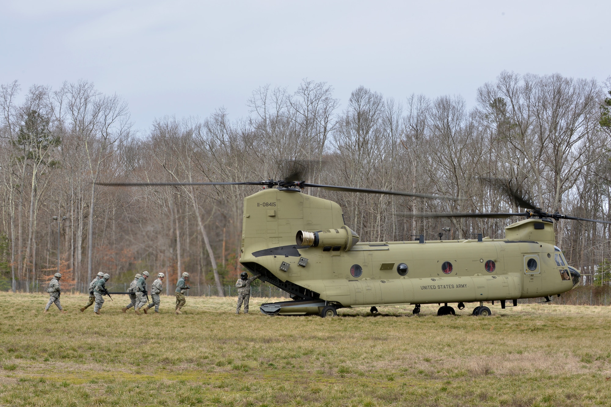 U.S. Army Soldier’s with the 558th Transportation Company practice carrying casualties to a CH-47 Chinook helicopter during an exercise at Fort Eustis, Va., March 3, 2016. During the exercise, the company assessed, treated and evacuated casualties in an austere environment. (U.S. Air Force photo by Staff Sgt. Natasha Stannard)
