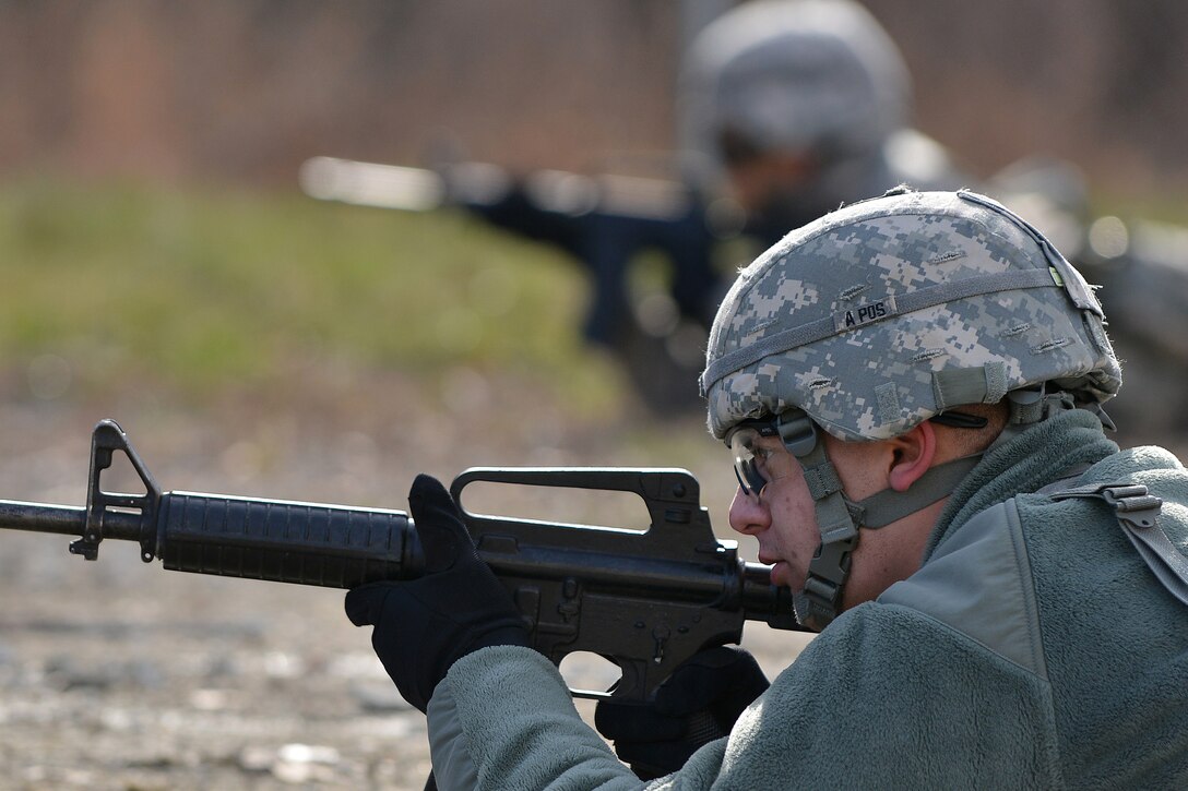 U.S. Army Soldiers with the 558th Transportation Company provide security for members of their team during a casualty evacuation exercise at Fort Eustis, Va., March 3, 2016.  The company practiced securing the perimeter to enable safe treatment of casualties. (U.S. Air Force photo by Staff Sgt. Natasha Stannard)