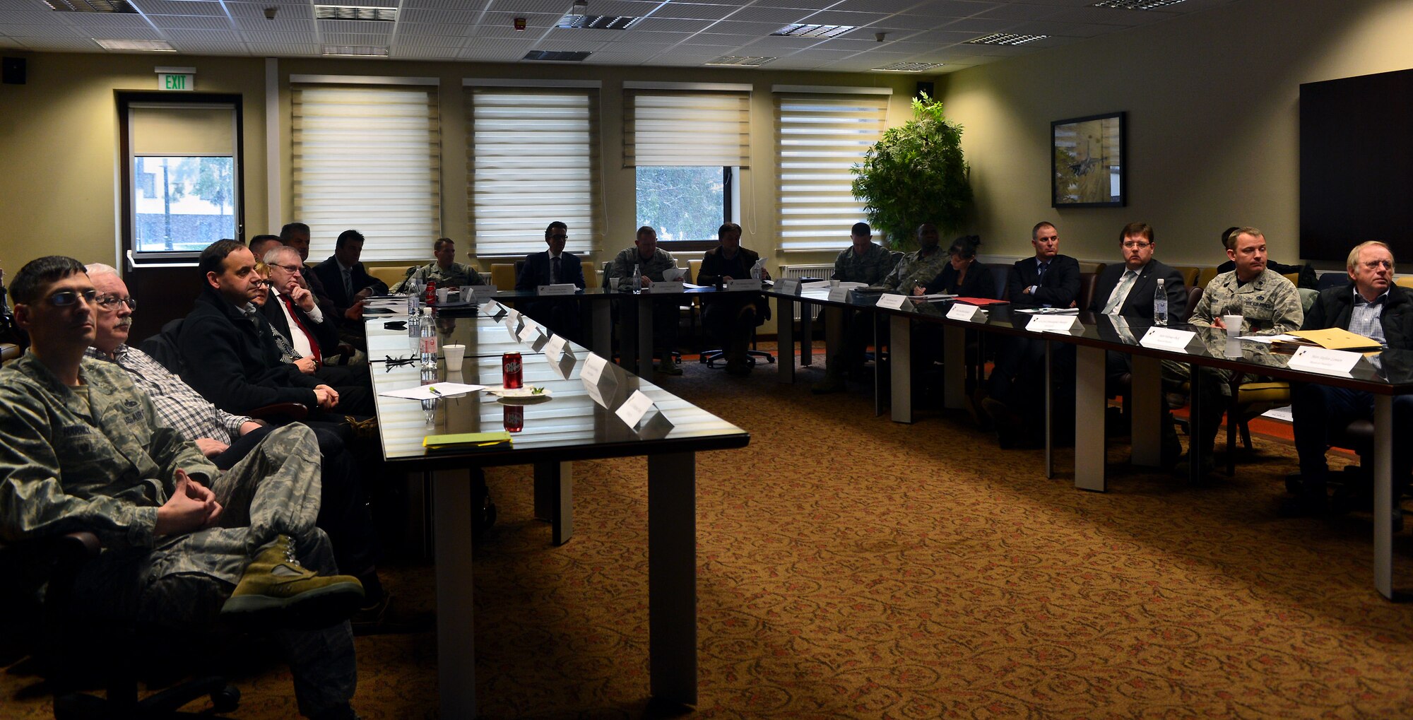 Leadership from Spangdahlem Air Base and local communities listen to a presentation during an information forum at Spangdahlem Air Base, Germany, March 4, 2016. The Biannual forum gives community leaders the opportunity to meet with base leadership to discuss issues and learn about upcoming base projects. (U.S. Air Force photo by 2nd Lt Meredith Mulvihill/Released)