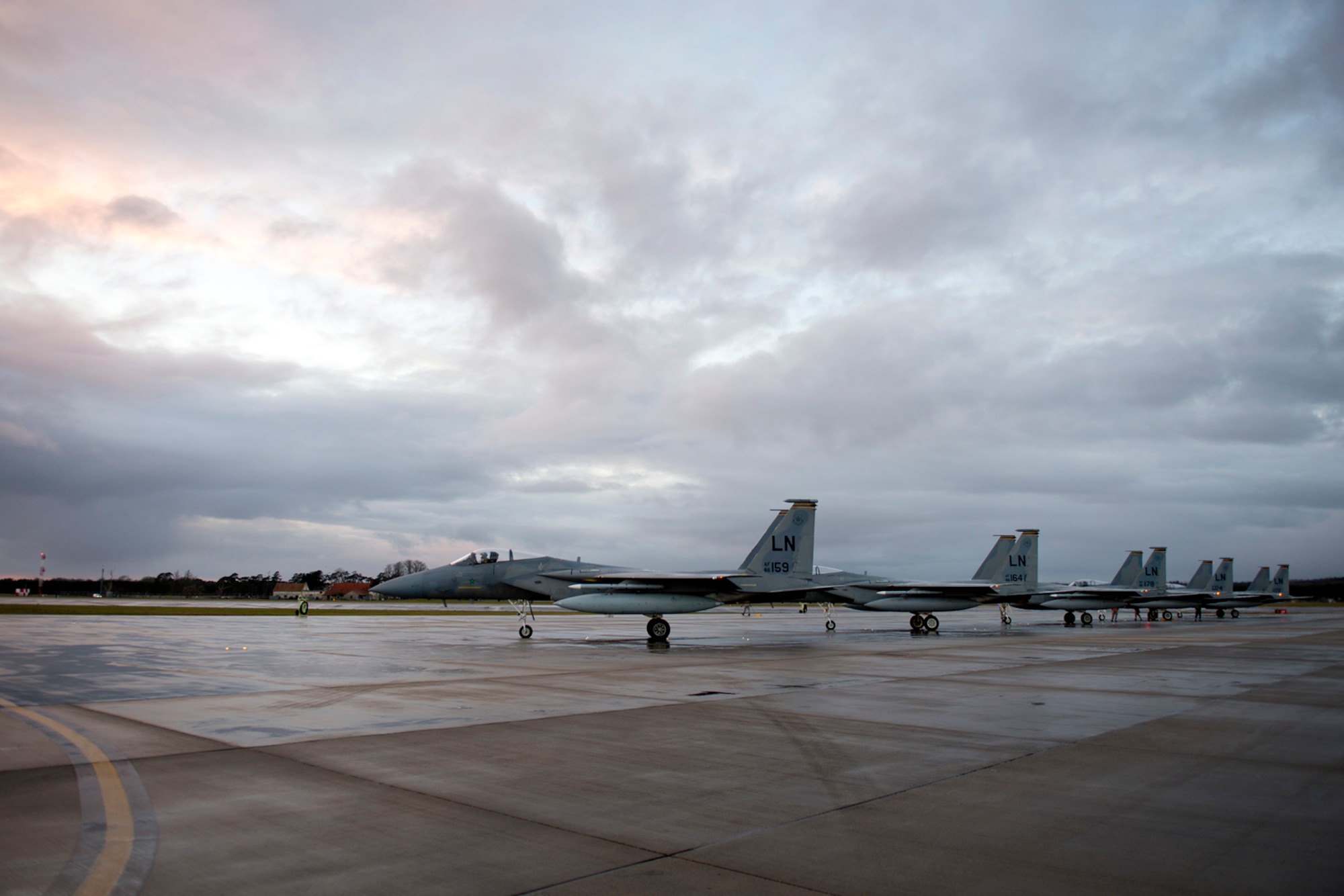 Airmen from the 748th Aircraft Maintenance Squadron perform final checks on F-15C Eagles from the 493rd Fighter Squadron for the next sortie at Royal Air Force Lakenheath, March 7, 2016. The 493rd FS maintains the ability to rapidly generate, deploy, and sustain operations to execute wartime and peacetime taskings in any theater of operations in the world. (U.S. Air Force photo/Airman 1st Class Erin R. Babis)