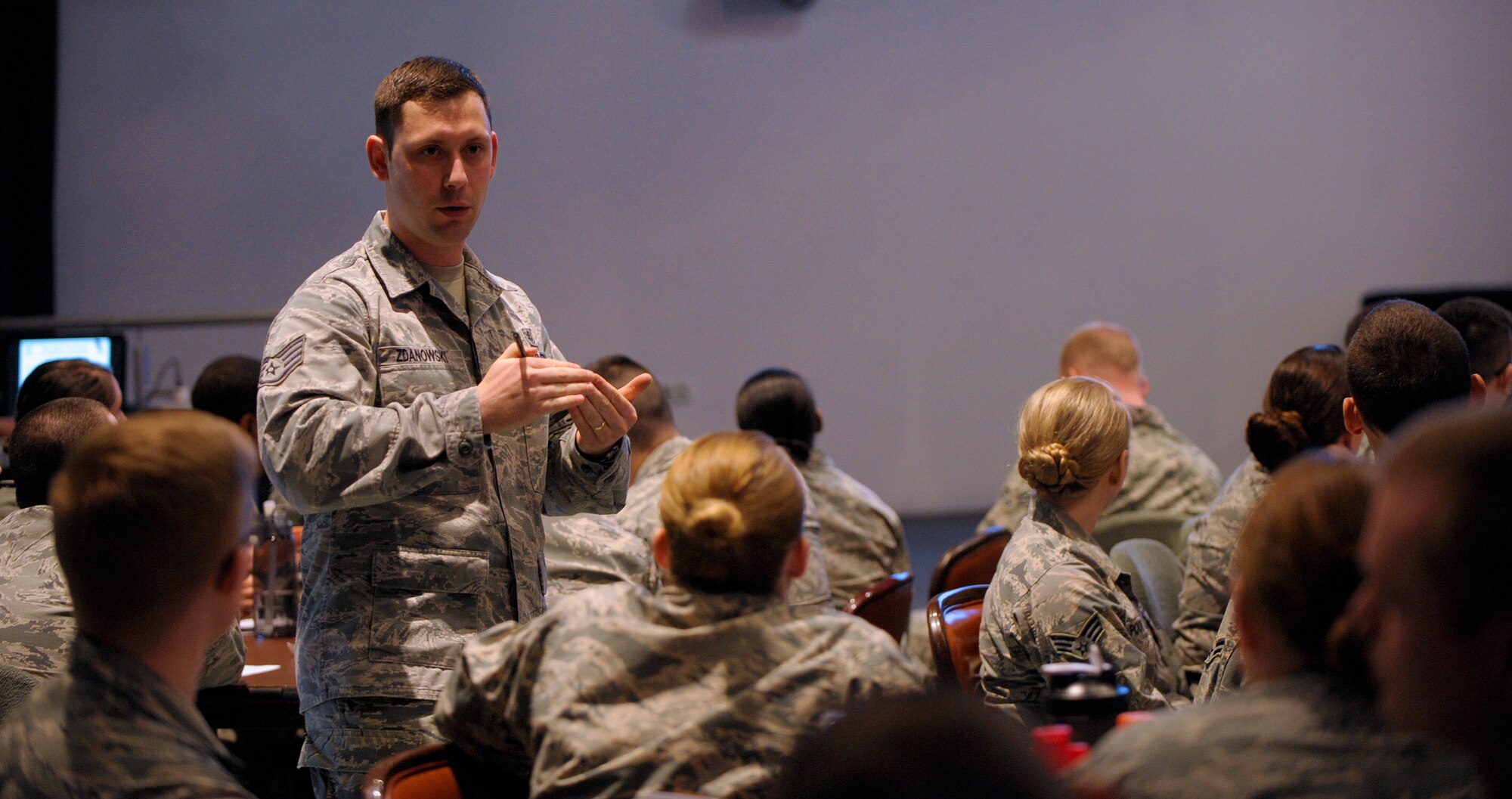 Staff Sgt. Paul Zdanowski, 86th Aerospace Medicine Squadron deployment medicine NCO in charge, briefs Airmen during the inaugural Airman Professional Enhancement Seminar March 7, 2016, at Ramstein Air Base, Germany. Subject matter experts gave Airmen information about being an individual while still working within a team, time management, customer service, nutrition and fitness, leadership and followership, and education among other things during the seminar. (U.S. Air Force photo/Staff Sgt. Timothy Moore)
