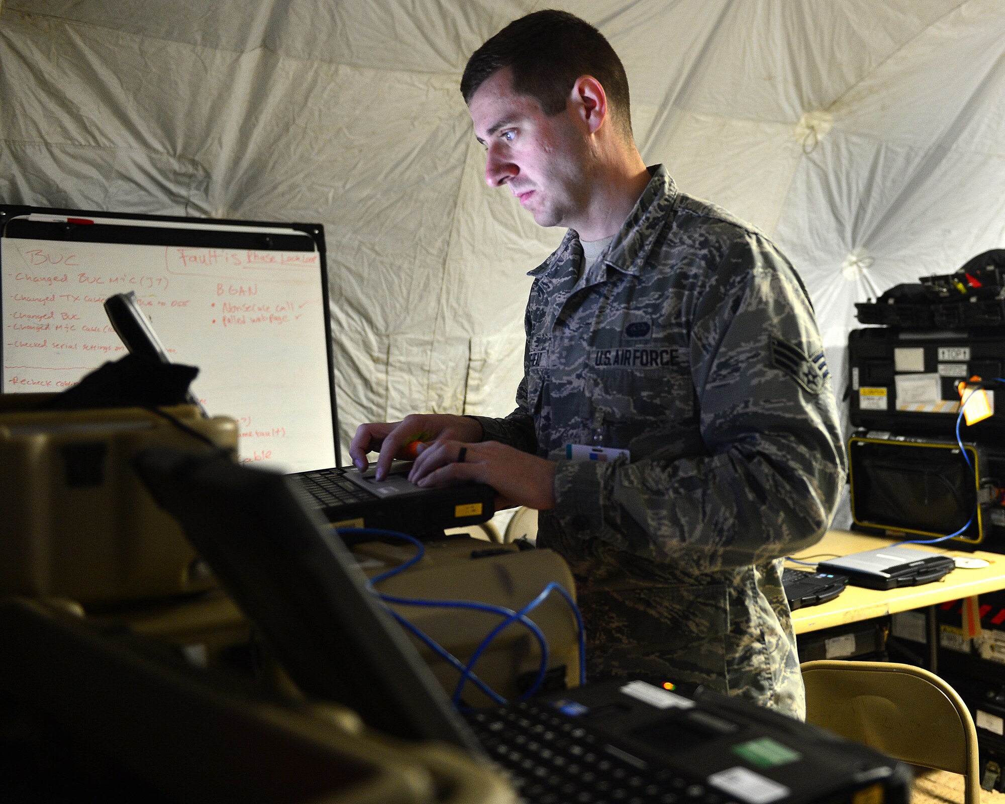 Senior Airman Mitchell Moorehead, 52nd Combat Communications Squadron Radio Frequency transmission specialist, setup communication centers in support of exercise Juniper Cobra 16 in Israel, Jan. 15, 2016. Juniper Cobra uses ballistic missile defense computer simulations to train U.S. and Israeli service members while reinforcing a strong military relationship. For the first time, Airmen from multiple units work together to support U.S. European Command. (U.S. Air Force Staff Sgt. Stephanie Longoria/Released)