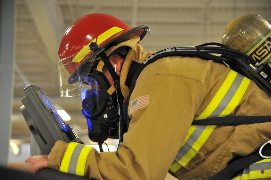 Scott Johns, 341st Civil Engineer Squadron fire and emergency services member, trains at the Malmstrom Air Force Base, Mont., gym Feb. 3, 2016 to prepare for the Scott Firefighter Stair Climb challenge hosted at the Columbia Center in downtown Seattle Feb. 28, 2016. Johns trained to climb the 788 vertical feet and 1,356 steps to the top of the Columbia Center as fast as possible with one bottle of oxygen. (U.S. Air Force photo/John Turner) 