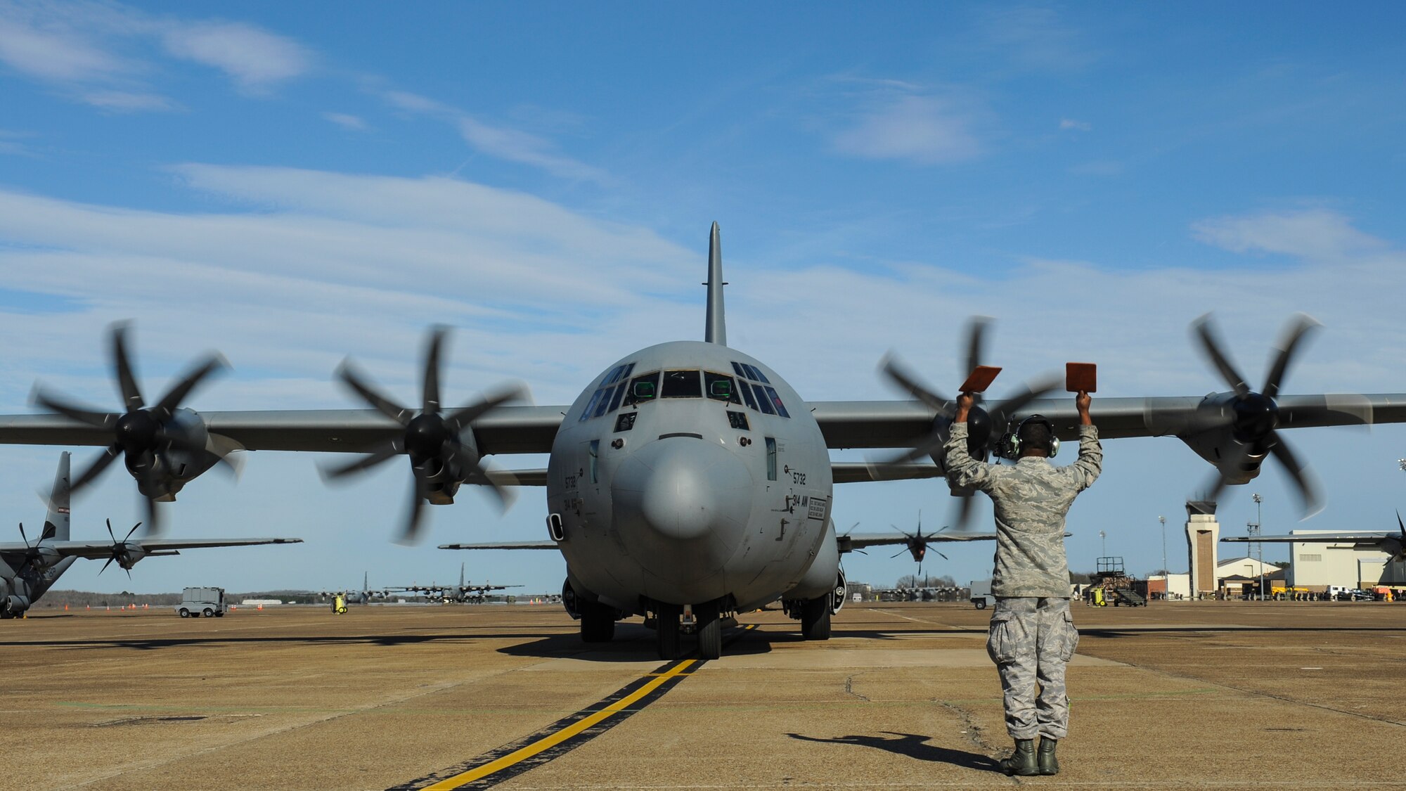 U.S. Air Force Senior Airman Zachariah Smoots, a 314th Aircraft Maintenance Squadron C-130J crew chief, marshals a C-130J March 2, 2016, at Little Rock Air Force Base, Ark. (U.S. Air Force photo/Senior Airman Harry Brexel)