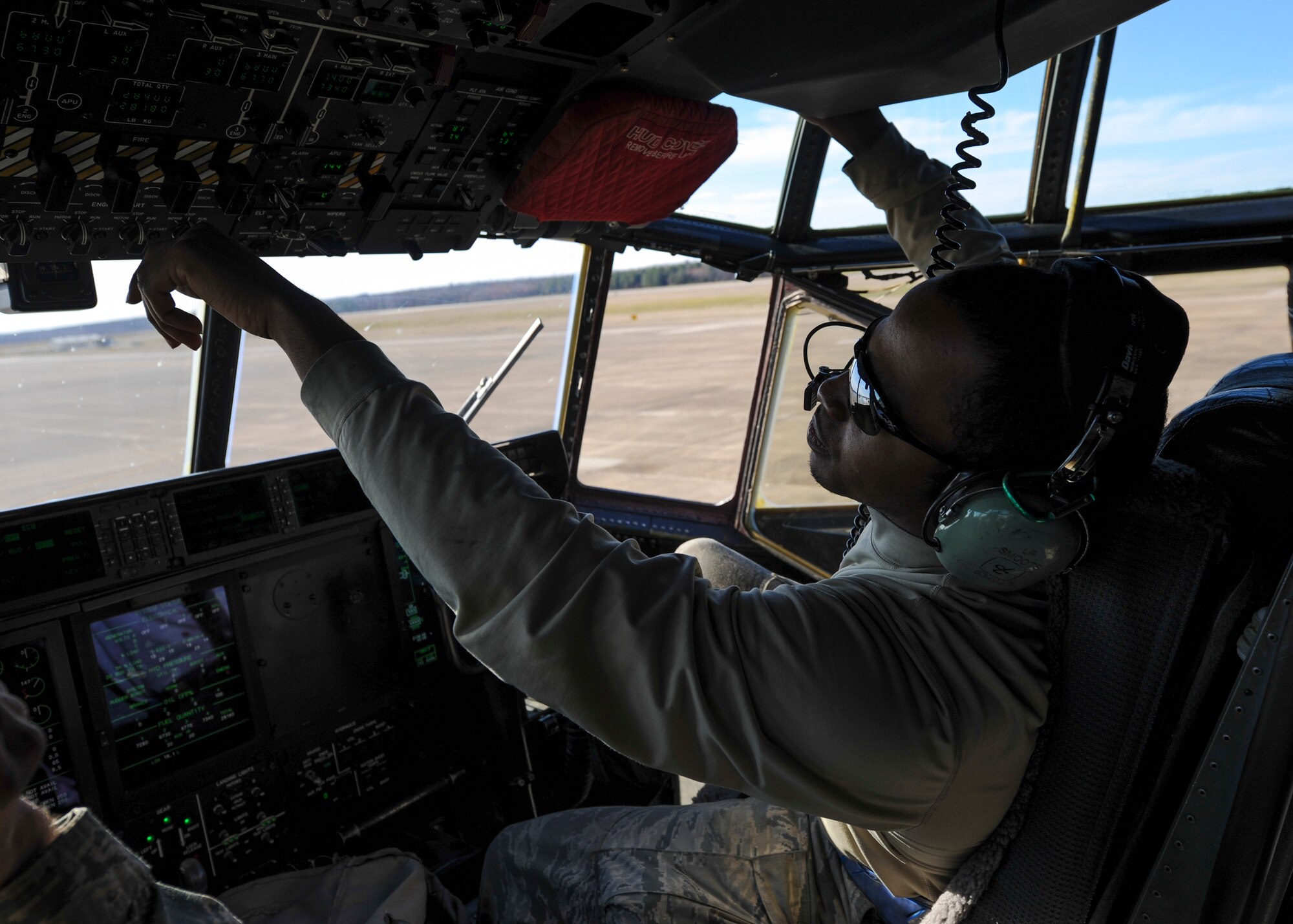 U.S. Air Force Senior Airman Zachariah Smoots, a 314th Aircraft Maintenance Squadron C-130J crew chief, performs a post flight inspection inside the flight deck of a C-130J March 2, 2016, at Little Rock Air Force Base, Ark. Crew chiefs ensure that the aircraft in their care are ready to fly at a moment’s notice so that pilots can safely and effectively complete their mission. (U.S. Air Force photo/Senior Airman Harry Brexel)