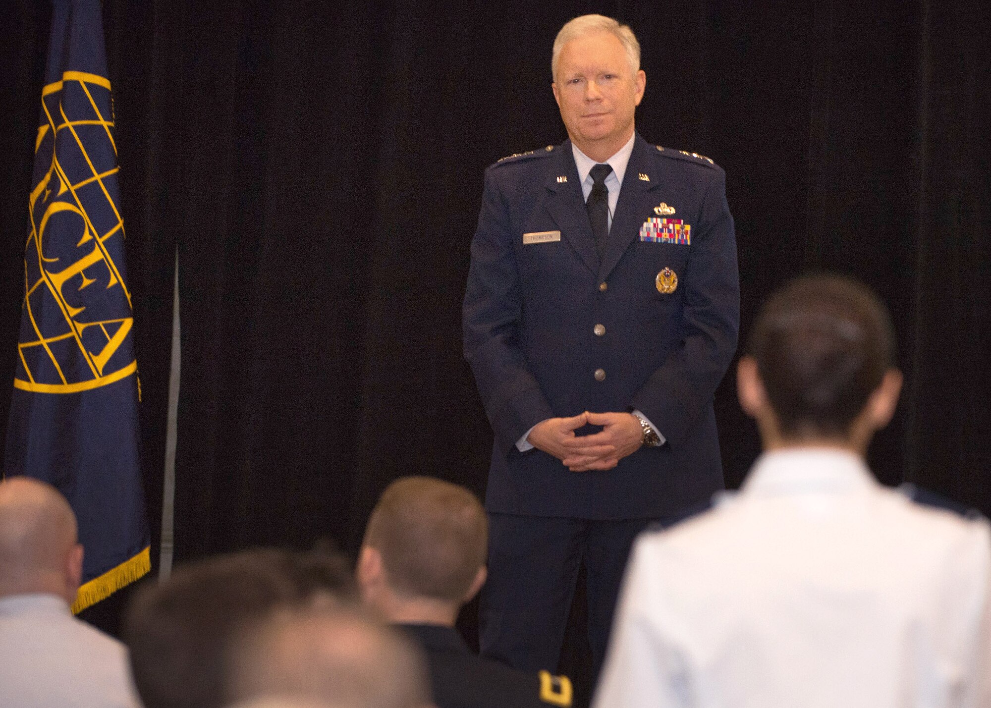 Lt. Gen. John Thompson, Air Force Life Cycle Management Center commander, listens to a question from an audience member during the New Horizons Symposium in Newton, Mass., March 1. Thompson provided the keynote address for the symposium, speaking about the Air Force Cyber Campaign Plan, including the need for cyber resiliency in all systems.  (U.S. Air Force photo by Jerry Saslav) 
