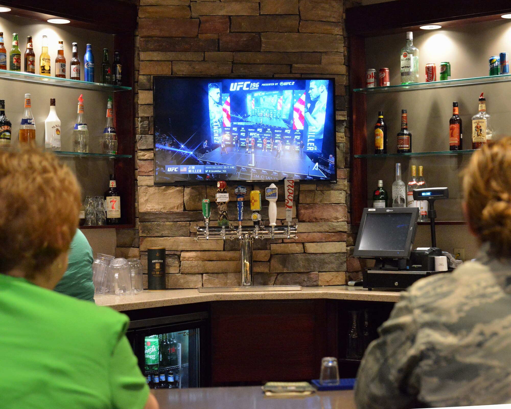 Three state-of-the-art 80 inch ultra high definition televisions adorn the walls of the newly renovated bar and grill at the Mountain View Club. The bar, called Relativity Bar and Grill, is becoming a popular spot for patrons; it saw more than 400 customers for a recent viewing of a UFC mixed martial arts fight. (Photo by Jamie Burnett)