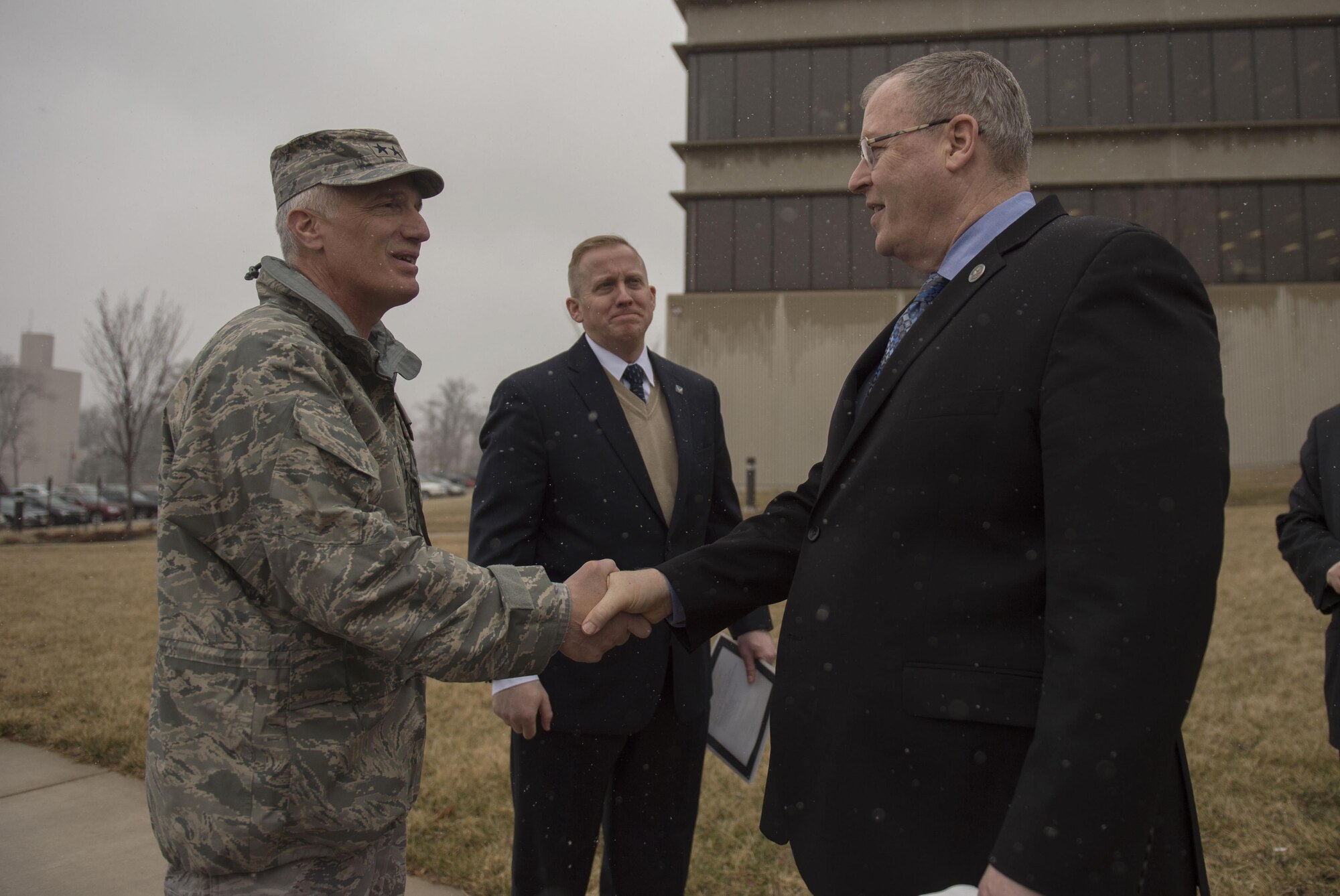 Deputy Defense Secretary Bob Work, right, says goodbye to Air Force Maj. Gen. Thomas J. Tom Masiello, commander, Air Force Research Laboratory as he prepares to depart Wright-Patterson Air Force Base, Ohio, after touring the base and speaking to a group of students from the local Dayton, Ohio, area during a 'Week at the Labs event March 3, 2016. (DoD photo/Air Force Senior Master Sgt. Adrian Cadiz.)