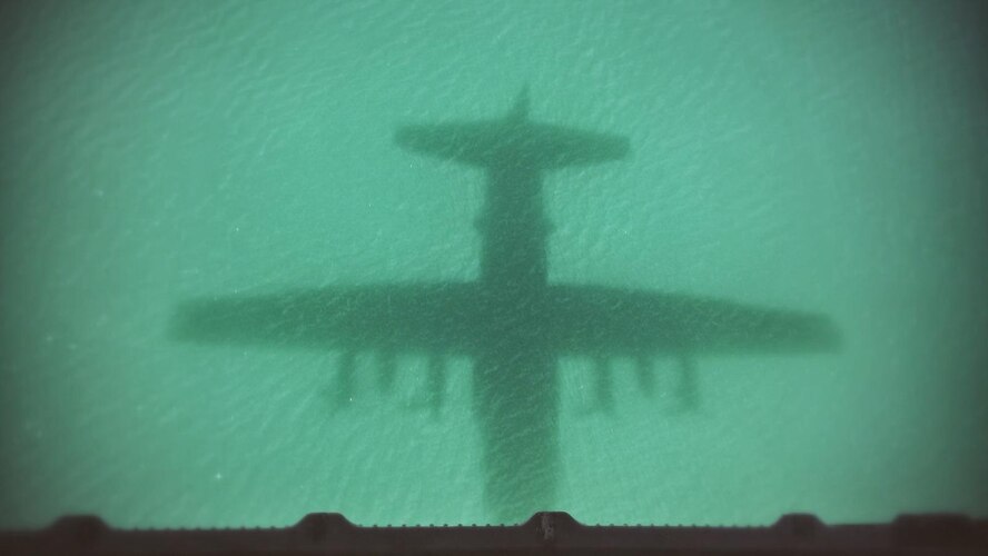 An HC-130 King shadow appears in the waters off Key West, Fla., March 5, 2016. Rescue Airmen from the 920th Rescue Wing, Patrick Air Force Base, Fla., were there to train alongside Canadian rescue personnel during the annual search-and-rescue exercise. (courtesy photo)