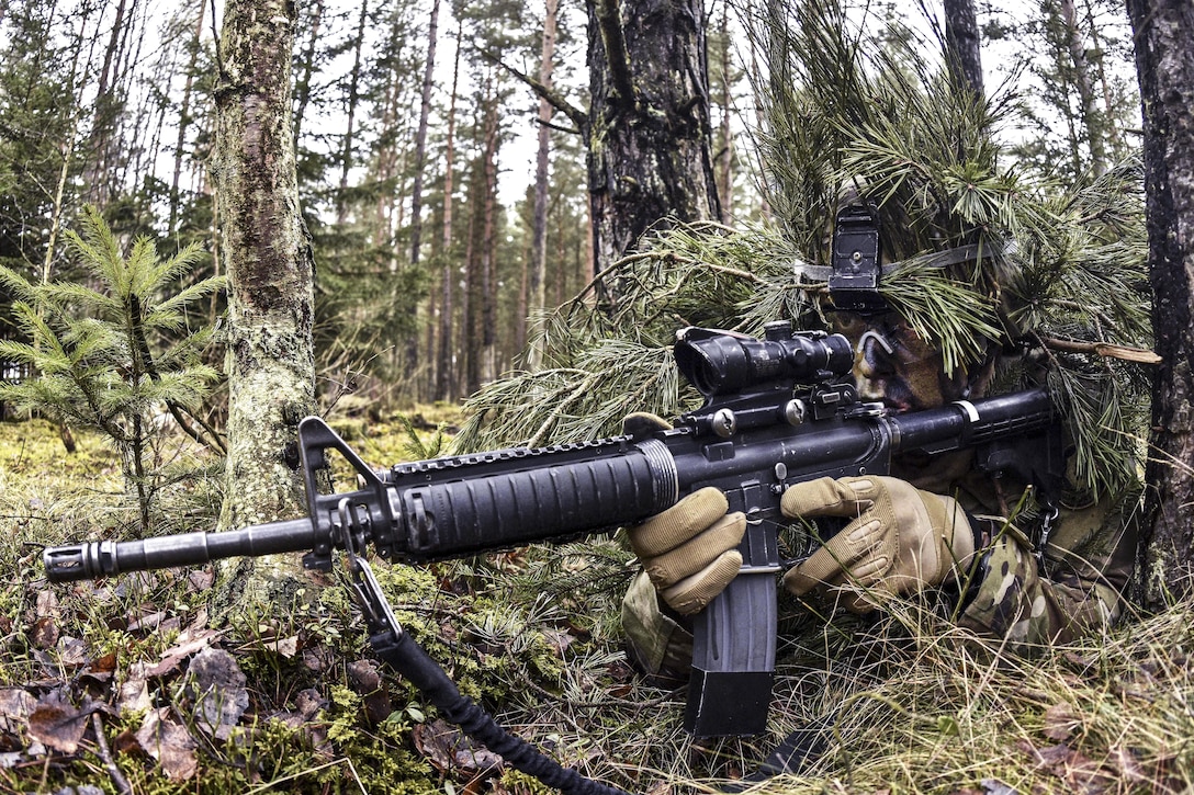 Army Cpl. Andrew Hernandez provides security for his team during a live-fire exercise at the Grafenwoehr Training Area, Germany, Feb. 24, 2016. Hernandez is a cavalry scout assigned to the 4th Squadron, 2nd Cavalry Regiment. Army photo by Sgt. William A. Tanner