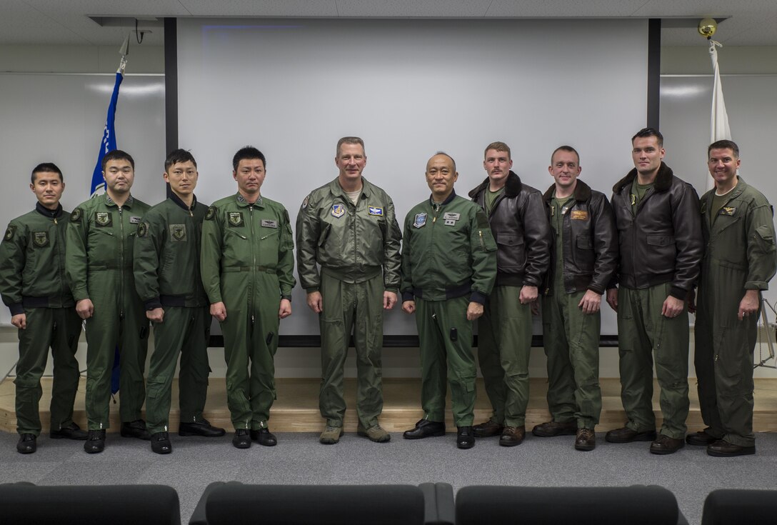 Japanese Air Self-Defense Forces and U.S. Marine pilots with Marine Fighter Attack Squadron (VMFA) 314, pose with Lt. Gen. John L. Dolan, commander of U.S. Forces Japan and 5th Air Force, during a visit to Komatsu Air Base, Japan, March 9, 2016.  Dolan emphasized the importance of bilateral training for both American and Japanese forces  during the Komatsu Aviation Training Relocation exercise. This international relationship is essential to security in the Pacific region. (U.S. Marine Corps photo by Cpl. Nicole Zurbrugg/Released)