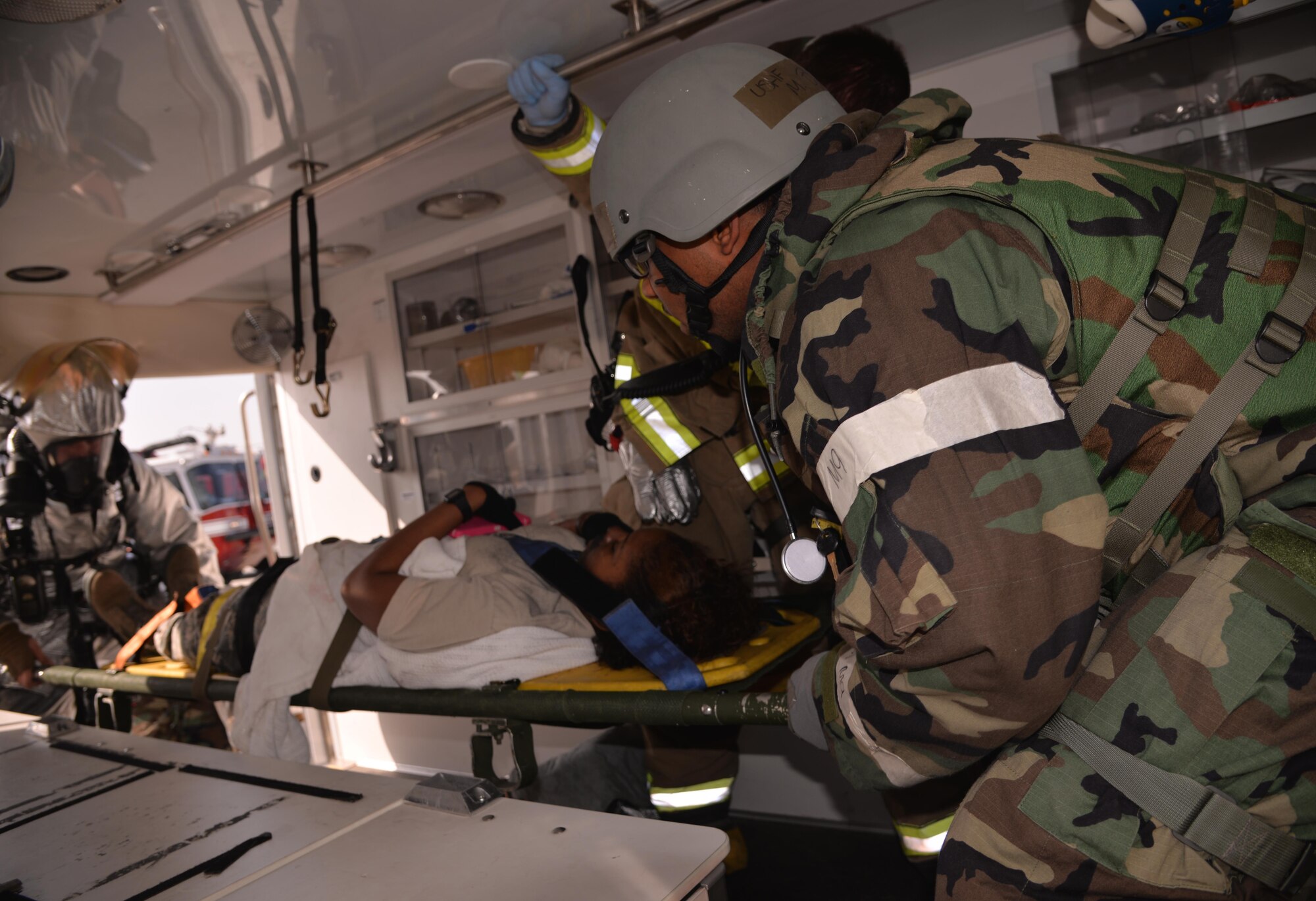 First responders load a simulated wounded victim into an emergency vehicle March 9, 2016, at Osan Air Base, Republic of Korea. The scenario, part of Exercise Beverly Midnight 16-01, involved a C-130H Hercules cargo aircraft assigned to the 374th Airlift Wing from Yokota Air Base, Japan, which took small-arms fire from opposing forces upon landing. Emergency responders from the 51st Fighter Wing’s fire department, security forces and medical facility swarmed the scene to provide assistance to the simulated causalities. (U.S. Air Force photo by Staff Sgt. Benjamin Sutton/Released)  