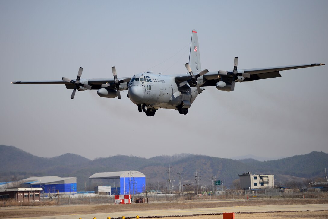 A C-130H Hercules cargo aircraft from the 374th Airlift Wing, Yokota Air Base, Japan, lands at Osan Air Base, Republic of Korea, March 9, 2016. The C-130H was used in Exercise Beverly Midnight 16-01 during a simulated flight emergency scenario to test first responders’ ability to operate in wartime conditions. (U.S. Air Force photo by Staff Sgt. Jonathan Steffen/Released)