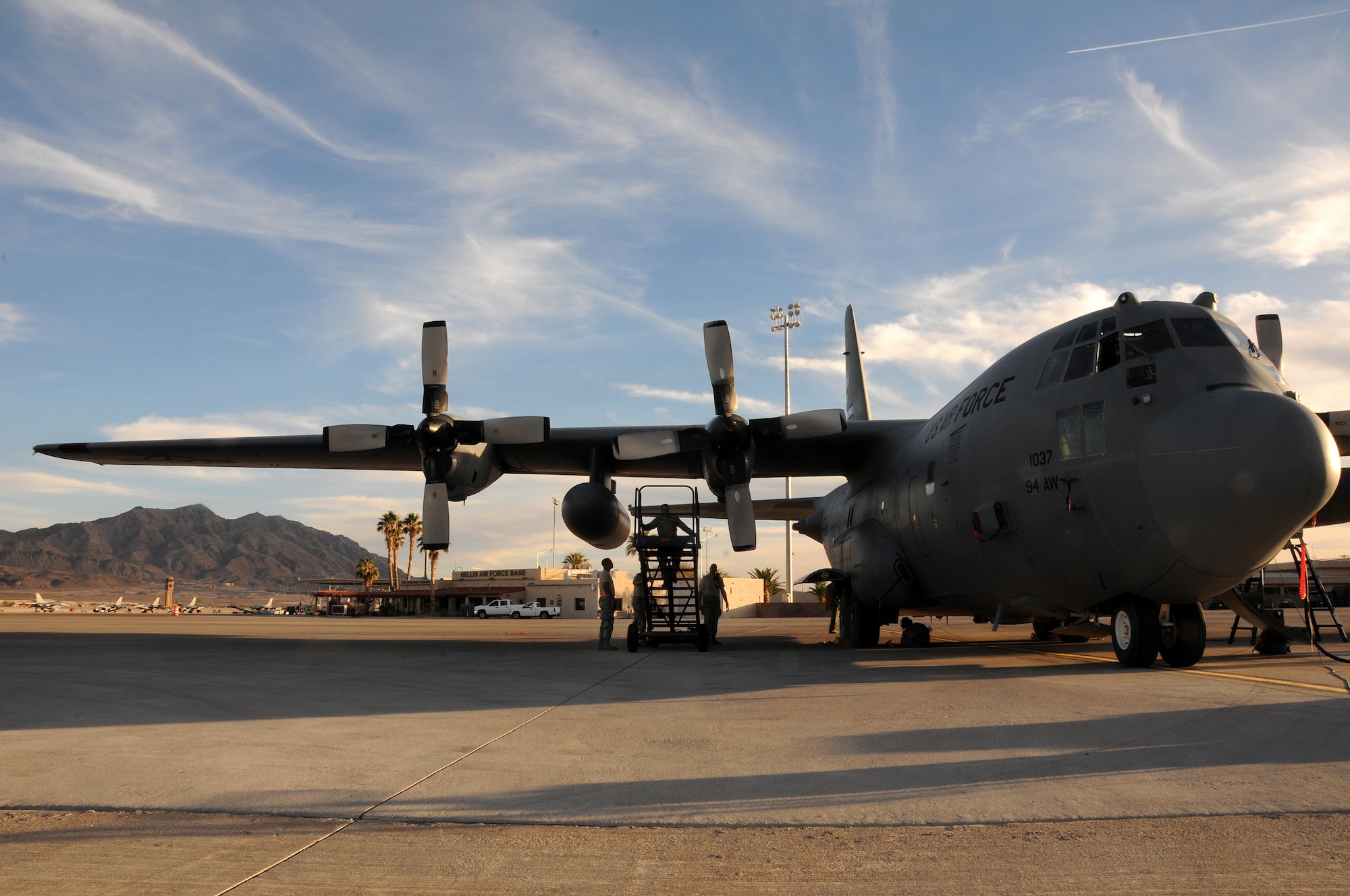 Crew chiefs from the 94th Airlift Wing perform maintenance on a C-130 Hercules after a flight during Red Flag 16-2 March 2, 2016 at Nellis Air Force Base, Nev. Red Flag is an exercise hosted by Nells AFB that provides aircrews an opportunity to experience realistic, stressful combat situations in a controlled environment to increase mission capability. (U.S. Air Force photo/Staff Sgt. Daniel Phelps)
