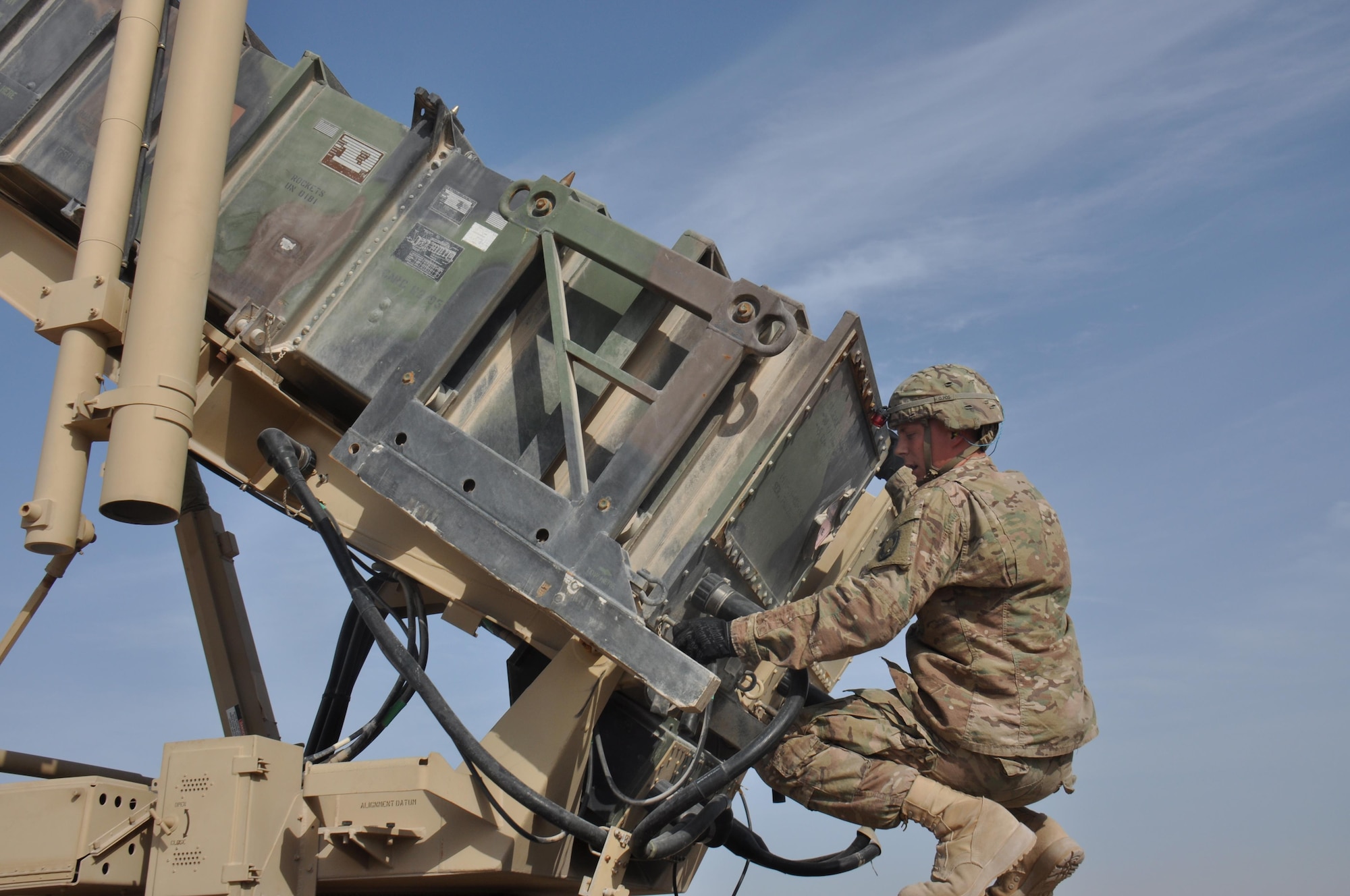Pfc. James Weaver, 1-62 Delta Battery Air Defense Artillery Regiment Patriot station launcher operator and maintainer from Steelville, Missouri, unlocks torque tubes behind a PAC-2 missile interceptor during an operational readiness exercise at Al Udeid Air Base, Qatar Mar. 4. The Patriot missiles at AUAB protect the base from a variety of airborne threats including tactical ballistic missiles and drones.  (U.S. Air Force photo by Tech. Sgt. James Hodgman/Released)