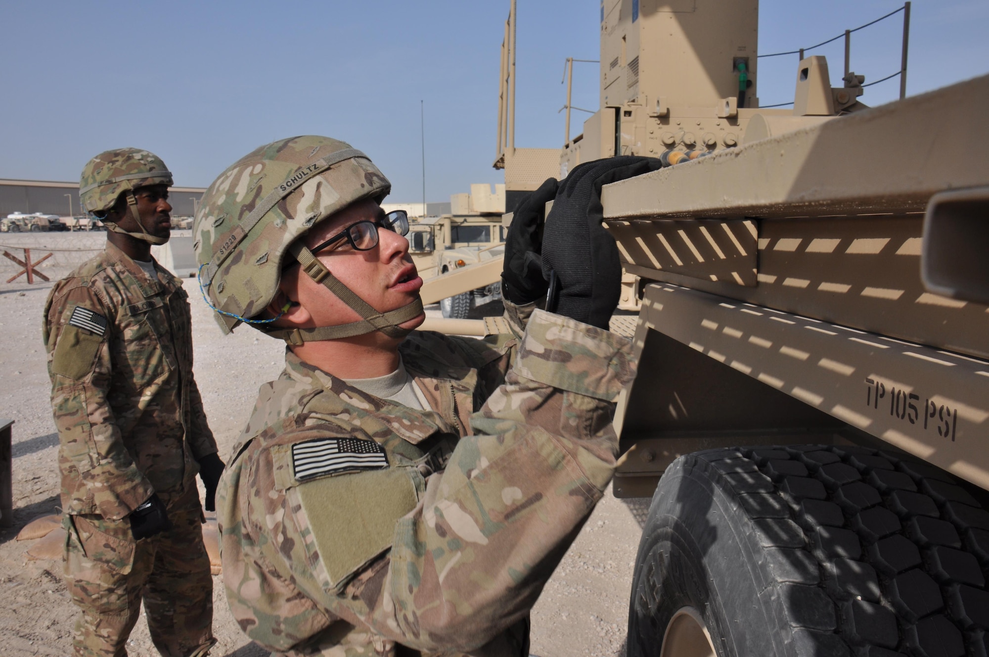 Pfc. Michael Schultz, 1-62 Delta Battery Air Defense Artillery Regiment Patriot station launcher operator and maintainer from Tampa, Florida, raises the launching station catwalks on a Patriot missile battery in preparation for reload operations during an operational readiness exercise at Al Udeid Air Base, Qatar Mar. 4. The Patriot missiles at AUAB protect the base from a variety of airborne threats including tactical ballistic missiles and drones.  (U.S. Air Force photo by Tech. Sgt. James Hodgman/Released)