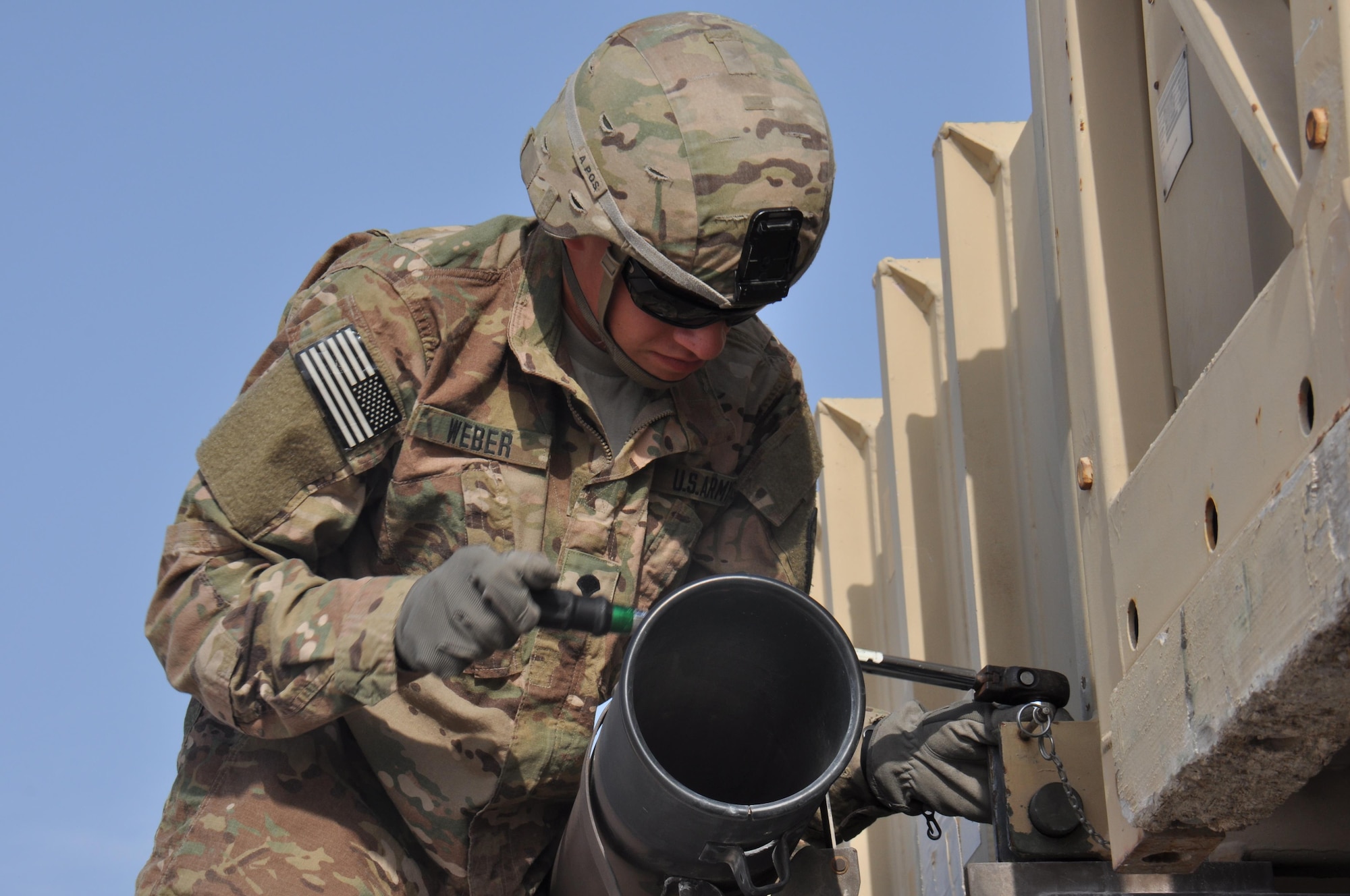 Pfc. Kelson Weber, 1-62 Delta Battery Air Defense Artillery Regiment Patriot station launcher operator and maintainer from Waukesha, Wisconsin, torques bolts in preparation for offloading a PAC-2 missile canister during a training exercise at Al Udeid Air Base, Qatar Mar. 4. The Patriot missiles at AUAB protect the base from a variety of airborne threats including tactical ballistic missiles and drones.  (U.S. Air Force photo by Tech. Sgt. James Hodgman/Released)