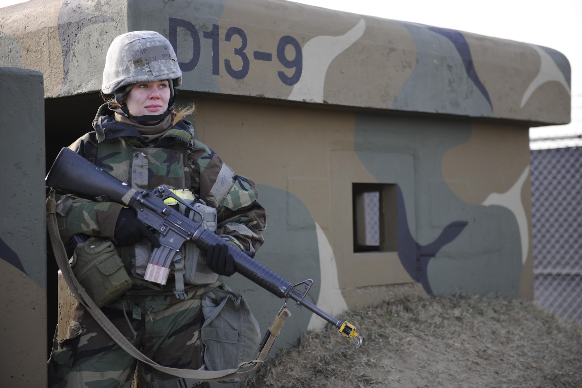 Senior Airman Stacey McRobbie, 8th Maintenance Squadron Non-Destructive Inspection tech inspector, scans her area of responsibility during Beverly Midnight 16-1, March 10, 2016, at Kunsan Air Base, Republic of Korea. Airmen from other career fields are trained to augment security forces personnel when the need for extra security is needed for real-world or exercise operations. (U.S. Air Force photo/Senior Airman Dustin King)