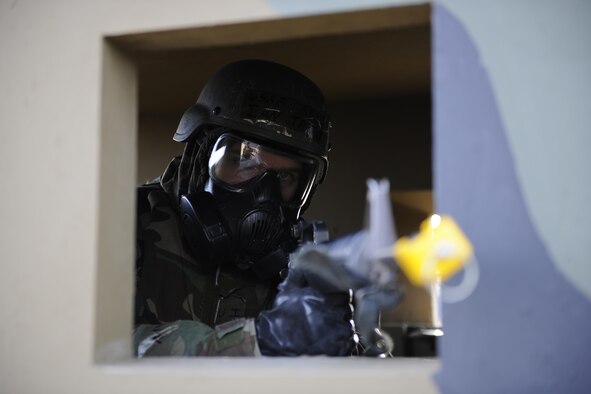 Airman 1st Class Ian Trafny, 8th Maintenance Group precision material equipment laboratory, scans his area of responsibility during Beverly Midnight 16-1, March 10, 2016, at Kunsan Air Base, Republic of Korea.  Airmen from other career fields are trained to augment security forces personnel when the need for extra security is needed for real-world or exercise operations. (U.S. Air Force photo/Senior Airman Dustin King)