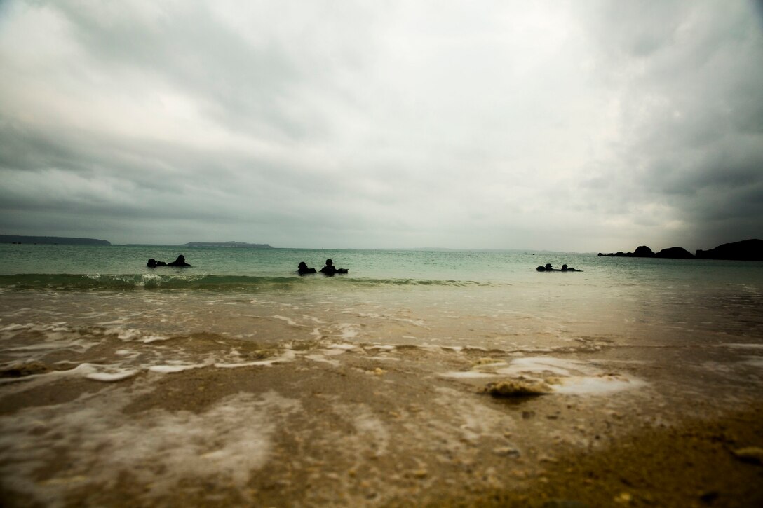Members of the Japan Ground Self-Defense Force conduct amphibious operations onto a beachhead Mar. 9 at Kin Blue, Okinawa, Japan. The JGSDF members observed Marines from 3rd Reconnaissance Battalion, 3rd Marine Division, III Marine Expeditionary Force, conducting raid missions, amphibious training and scout swimmer classes. The JGSDF members are with the 43rd Infantry Regiment, 8th Division, Western Army. (U.S. Marine photo by Cpl. Tyler S. Giguere/Released)