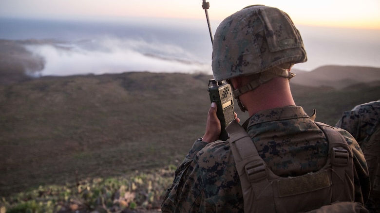 Lance Cpl. Christian Frohlich, a radio operator with 1st Air Naval Gunfire Liasion Company, relays fire missions to the objective area of a naval gunfire bombing range during the supporting arms coordination center exercise portion of Exercise Iron Fist 2016, on San Clemente, California, Feb. 21, 2016. The SACCEX provides U.S. and Japanese forces with hands-on experience in tactics proven to be effective in securing enemy-occupied shorelines during large-scale amphibious assaults.