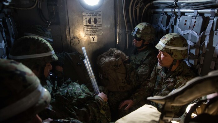 Soldiers with Western Army, Japan Ground Self-Defense Force, await their debarkation of a landing craft air cushion onto San Clemente Island, California, Feb. 21, 2016, as part of the supported arms coordination center exercise portion of Exercise Iron Fist 2016. Iron Fist is an annual, bilateral amphibious training exercise designed to improve USMC and JGSDF’s ability to plan, communicate and conduct combined amphibious operations at the platoon, company and battalion levels. 