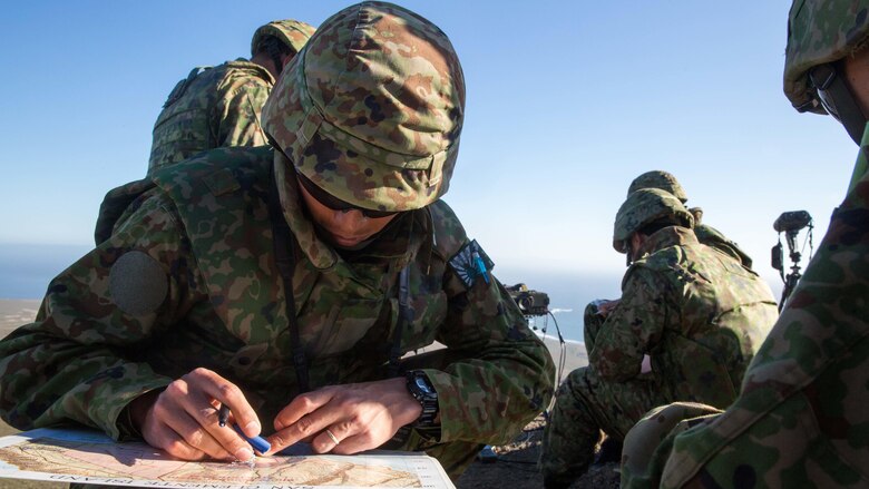 A soldier with Western Army Infantry Regiment, Japan Ground Self-Defense Force, plots map points for impending naval gunfire during a supporting arms coordination center exercise at San Clemente Island, California, Feb. 21, 2016, during Exercise Iron Fist 2016. The SACCEX serves as a cooperative learning tool for the US-Japan partnership through the operation of a supporting arms coordination center, which has developed the USMC and JGSDF’s ability to integrate naval gunfire, mortars and close-air support  as a combined force.
