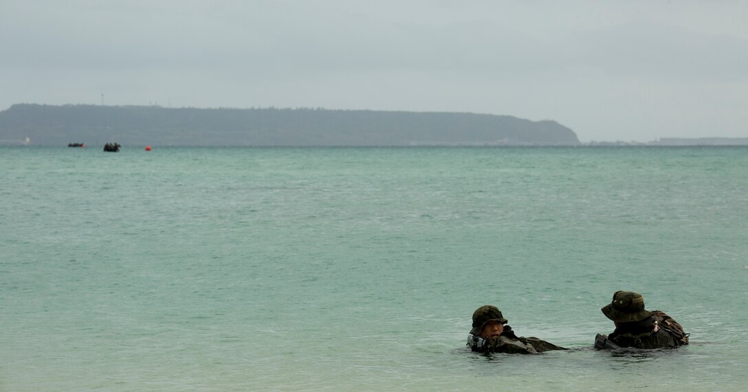 Members of the Japan Ground Self-Defense Force conduct amphibious operations onto a beachhead Mar. 9 at Kin Blue, Okinawa, Japan. The JGSDF members observed Marines from 3rd Reconnaissance Battalion, 3rd Marine Division, III Marine Expeditionary Force, conducting raid missions, amphibious training and scout swimmer classes. The JGSDF members are with the 43rd Infantry Regiment, 8th Division, Western Army. (U.S. Marine Corps photo by Cpl. Tyler Ngiraswei/Released)