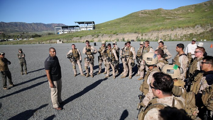 Assistant Secretary of the Navy Honorable Franklin Parker talks with the Marines of Company A, 1st Reconnaissance Battalion, 1st Marine Division, during close quarter battle training at Marine Corps Base Camp Pendleton, California, March 8, 2016. During his visit of the training, Parker observed Marines perform room clearing techniques and close-quarter marksmanship.