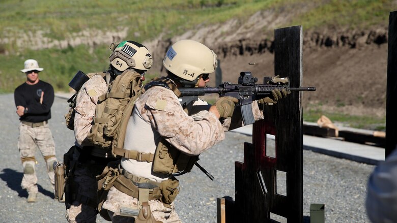 Marines of Company A, 1st Reconnaissance Battalion, 1st Marine Division, conducts target recognition and engagement through a simulated door way during the close quarter marksmanship portion of close quarter battle training at Marine Corps Base Camp Pendleton, California, March 8, 2016. The training focused on room clearing procedures along with close quarter marksmanship in a series of challenging drills. 