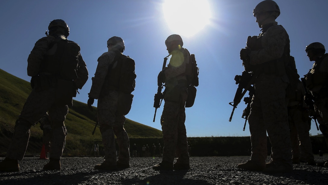 Marines of Company A, 1st Reconnaissance Battalion, 1st Marine Division, observe fellow Marines conducting close quarter marksmanship drills during close quarter battle training at Marine Corps Base Camp Pendleton, California, March 8, 2016. The training focused on room clearing procedures along with close quarter marksmanship in a series of challenging drills. 