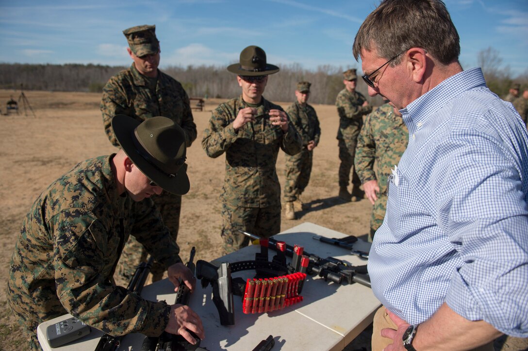 Defense Secretary Ash Carter observes various weapons as he tours the Weapons Training Battalion on Marine Corps Base Quantico, Va., March 9, 2016. DoD photo by Air Force Senior Master Sgt. Adrian Cadiz