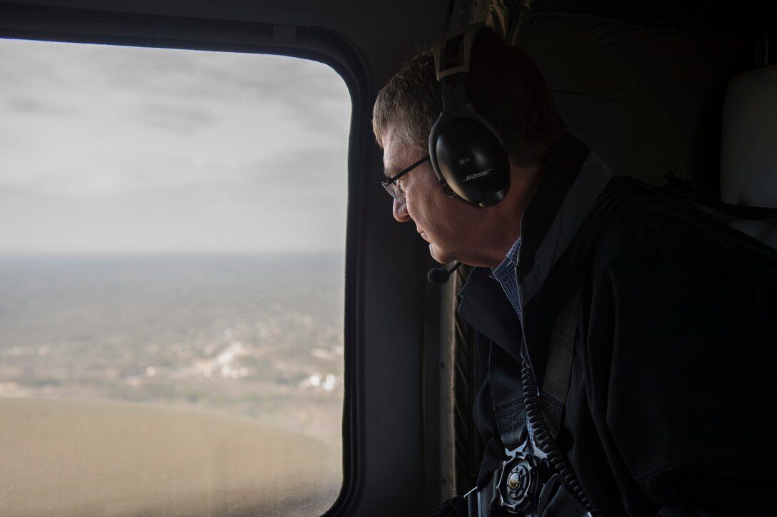Defense Secretary Ash Carter uses a headset to communicate with an Army UH-60 Helicopter aircrew as he flies to Marine Corps Base Quantico, Va., March 9, 2106,  to observe training and speak with Marines. DoD photo by Air Force Senior Master Sgt. Adrian Cadiz