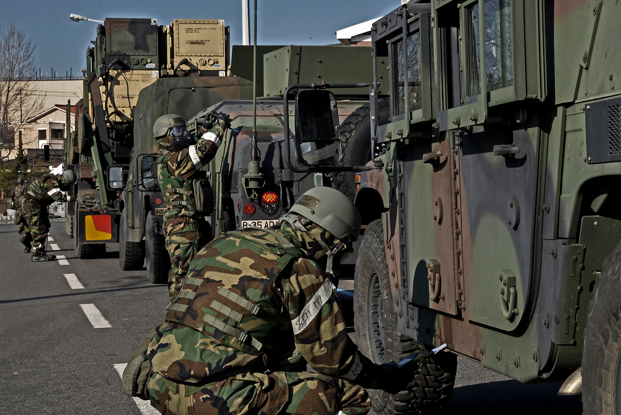Airmen from the 51st Civil Engineer Squadron chemical, biological, radiological and nuclear reconnaissance team inspect U.S. Army vehicles for possible contamination during Exercise Beverly Midnight 16-01 March 10, 2016, on Osan Air Base, Republic of Korea. Two months of coordination went into making the scenario possible -- a scenario which brought ROK and U.S. soldiers and airmen together. (U.S. Air Force photo by Tech. Sgt. Travis Edwards/Released)