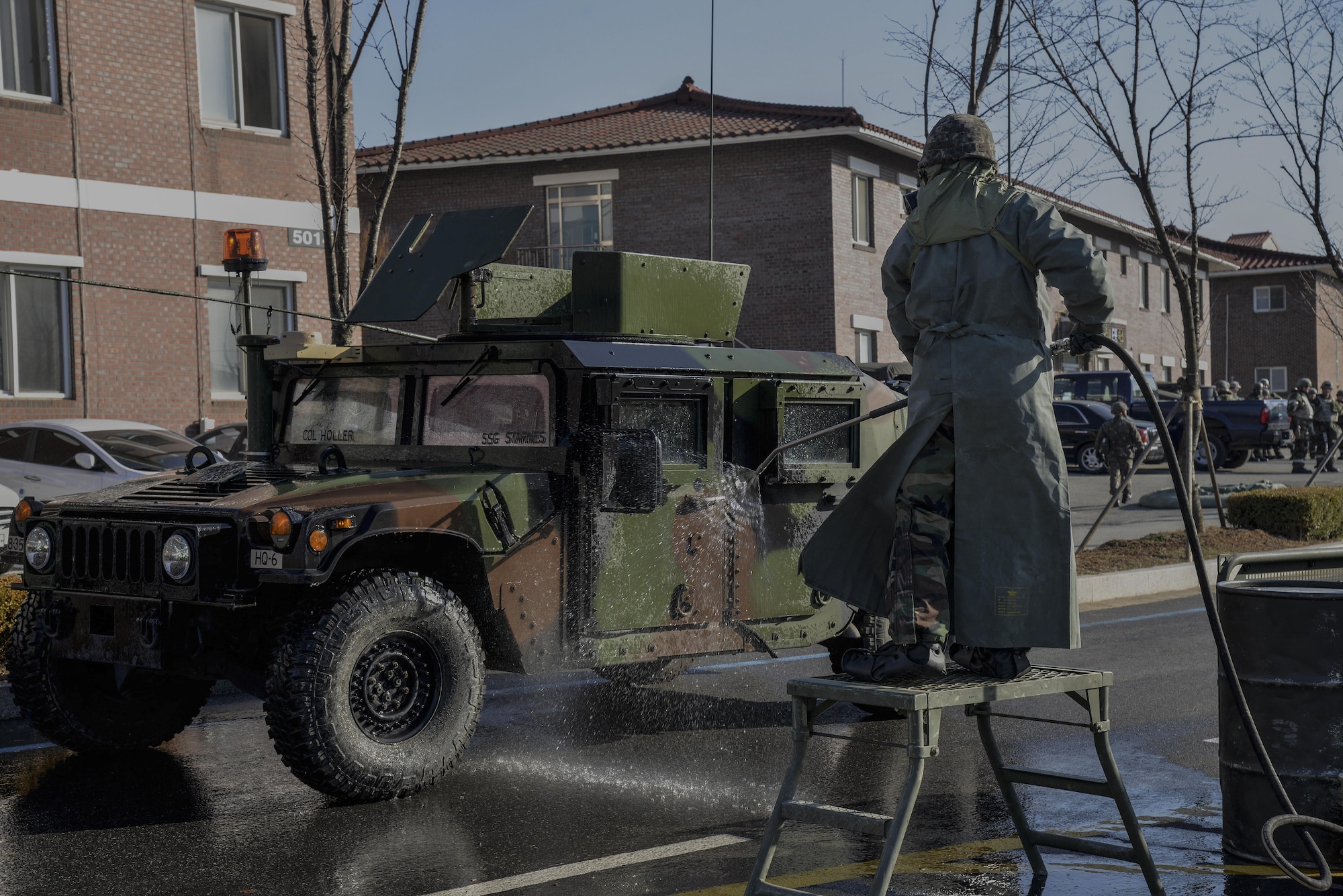 A Republic of Korea army soldier sprays down a U.S. Army Humvee to remove contaminates during a training scenario in Exercise Beverly Midnight 16-01 March 10, 2016, on Osan Air Base, ROK. The scenario ended after the ROK members, who sprayed down the vehicles, then processed through a contamination control point. BM 16-01 is an exercise designed to test the warfighting capabilities of the units assigned to the 51st Fighter Wing with a focus on readiness, defending the base and executing flying operations. (U.S. Air Force photo by Tech. Sgt. Travis Edwards/Released) 