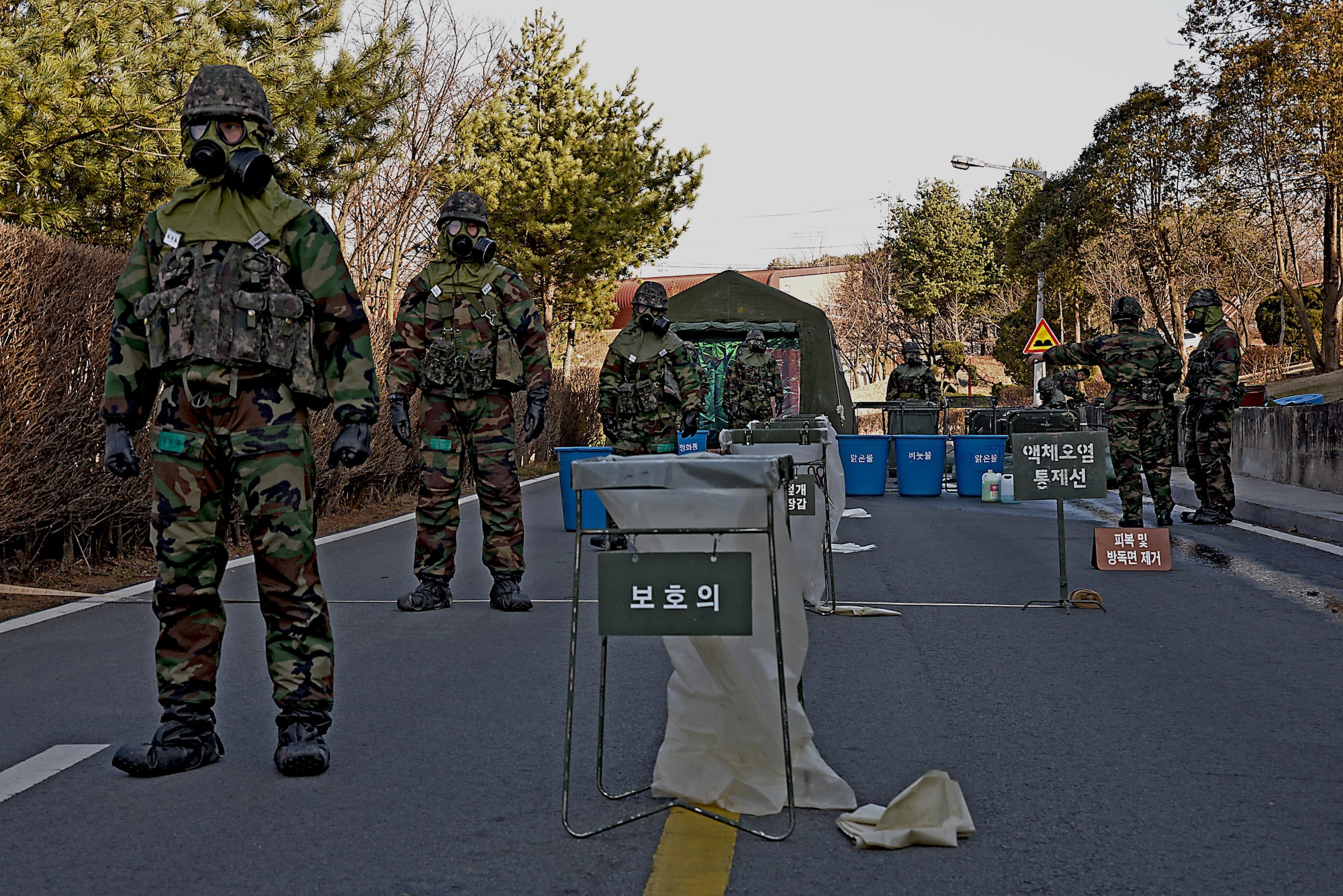 Republic of Korea army soldiers stand ready to receive other ROKA members who helped pressure wash contaminates from U.S. Army vehicles during a training scenario in Exercise Beverly Midnight 16-01 March 10, 2016, on Osan Air Base, ROK. Two months of coordination went into making the scenario possible – a scenario which brought members of the ROK and U.S. army and air force to work together. (U.S. Air Force photo by Tech. Sgt. Travis Edwards/Released)