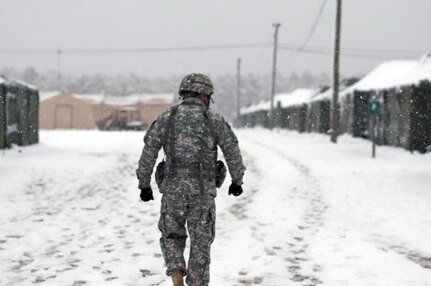 Maj. Julius Penn, public affairs officer for the 316th Sustainment Command (Expeditionary), takes a walk through Contingency Operating Location Victory during Combat Sustainment Support Exercise 78-16-01 at Joint Base McGuire-Dix-Lakehurst, N.J., March 3, 2016. CSTX 78-16-01 is a U.S. Army Reserve exercise conducted at multiple locations across the country designed to challenge combat support units and Soldiers to improve and sustain the skills necessary during a deployment. (U.S. Army photo by Sgt. Christopher Bigelow/Released)