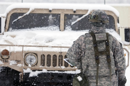 A Soldier with the 301st Regional Support Group performs a walk around inspection of a Humvee as part of a preventative maintenance check during Combat Sustainment Support Exercise 76-16-01 at Joint Base McGuire-Dix-Lakehurst, N.J., March 4, 2016. CSTX 78-16-01 is a U.S. Army Reserve exercise conducted at multiple locations across the country designed to challenge combat support units and Soldiers to improve and sustain the skills necessary during a deployment. (U.S. Army photo by Sgt. Christopher Bigelow/Released)