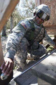 Spc. Saul Mercado, a horizontal construction engineer with the 475th Construction Company (Horizontal), an Army Reserve unit from Puerto Rico, measures a set of stairs prior to making repairs during Combat Sustainment Support Exercise 78-16-01 at Fort Hunter-Liggett, Calif., March 8, 2016. (U.S. Army photo by Sgt. Christopher Bigelow/Released)