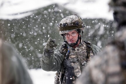 Sgt. 1st Class Mathew Hampson, a laundry shower and clothing repair non-commissioned officer with the 301st Regional Support Group, reinforces the proper way to perform a road guard detail during Combat Sustainment Support Exercise 78-16-01 at Joint Base McGuire-Dix-Lakehurst, N.J., March 4, 2016. CSTX 78-16-01 is a U.S. Army Reserve exercise conducted at multiple locations across the country designed to challenge combat support units and Soldiers to improve and sustain the skills necessary during a deployment. (U.S. Army photo by Sgt. Christopher Bigelow/Released)