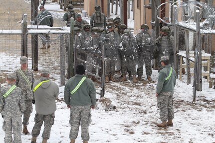 Soldiers equipped with riot shields 
conduct detainee operations on Joint Base McGuire-Dix-Lakehurst, N.J., March 4, 2016. Soldiers of the 367th MP Company are participating in Combat Support Training Exercise 78-16-01 to improve unit readiness.