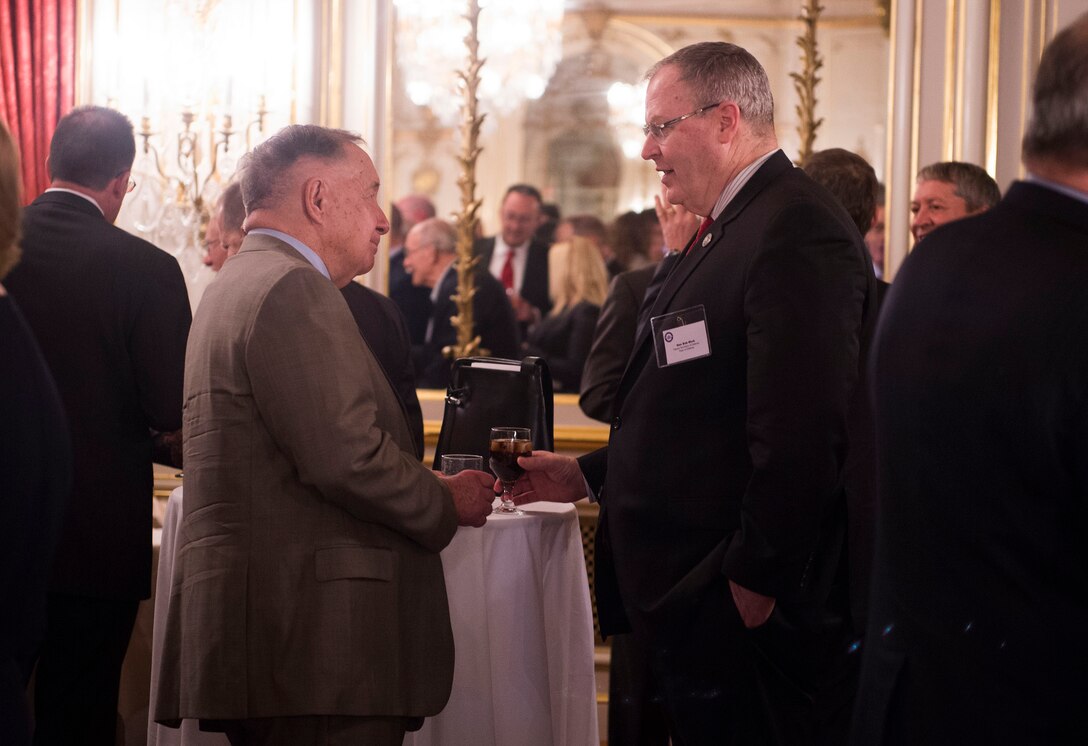 Deputy Defense Secretary Bob Work speaks with an attendee at the Desert Storm 25 Year Commemoration symposium hosted by the Mitchell Institute for Aerospace Studies in Washington, D.C., March 9, 2016. DoD photo by Navy Petty Officer 1st Class Tim D. Godbee