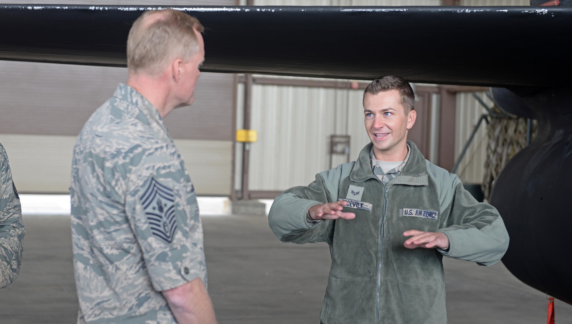Senior Airman Joseph McEvily (right), 9th Aircraft Maintenance Squadron U-2 Dragon Lady avionics technician, familiarizes Chief Master Sgt. of the Air Force James Cody with some of the components and capabilities of the U-2 March 8, 2016, at Beale Air Force Base, California. Cody’s visit consisted of meeting and candidly speaking with Airmen and to view Beale’s contributions to mission success. (U.S. Air Force photos by Senior Airman Ramon A. Adelan)