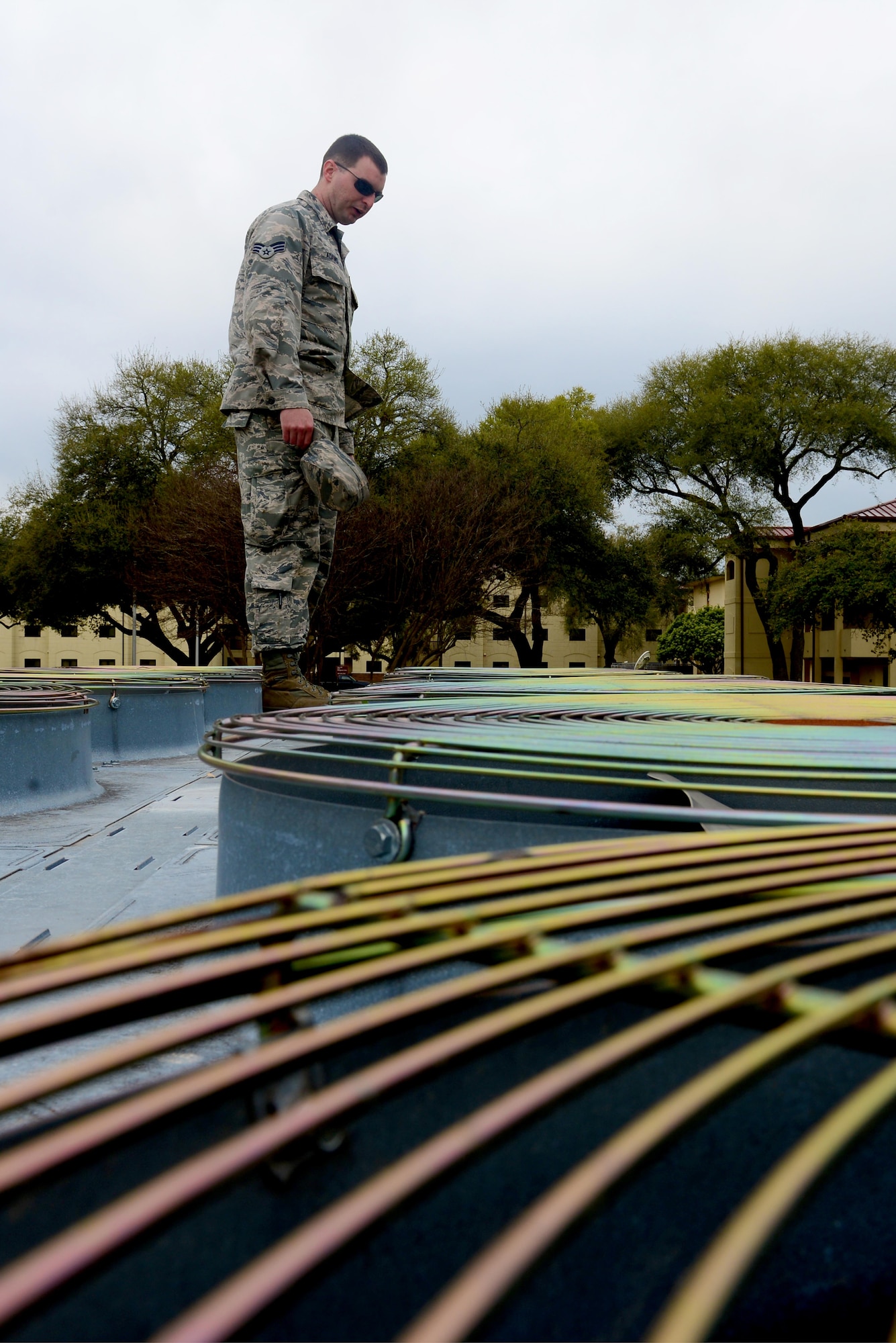 Senior Airman Troy Adams, 2nd Civil Engineer Squadron heating ventilation and air conditioning systems technician, checks HVAC air vents at Barksdale Air Force Base, La., March 7, 2016. HVAC Airmen ensure the servers running Barksdale’s communications are constantly cooled to an appropriate temperature. (U.S. Air Force Photo/Airman 1st Class Luke Hill)