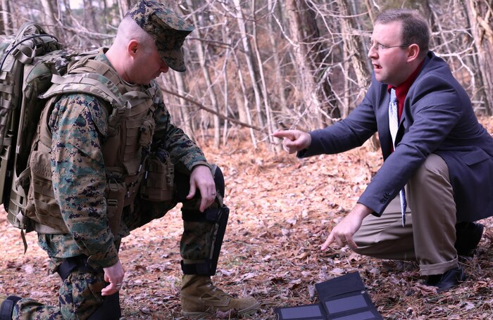 The Joint Infantry Company Prototype (JIC-P) solar panel is the topic of discussion between Marine Capt. Anthony Ripley and Eric South, Naval Surface Warfare Center Dahlgren Division technical lead for JIC-P. While Marines are on break during a march, they can pull out the solar panels and recharge batteries. The system features bionic and solar power enabling Marines and Soldiers to patrol longer without resupply. The Business Intelligence Group (BIG) recently selected JIC-P for the 2016 BIG Innovation Award. BIG awardees are recognized for innovations that are making major impacts in today’s world. Meanwhile, 3,000 business leaders selected the project as a "best of the best" finalist for the 2016 Edison Awards, a program that honors the most innovative new products, services, and business leaders across the globe. Award winners will be announced and ranked on April 21 at the Edison Awards Annual Gala in New York City.