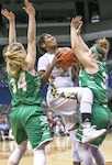 Cole High School senior Dalesia Booth (center) attempts to shoot around two
Wall High School defenders during the Region IV District 3 semifinal game
at the state championship at the Alamodome March 3. Wall won the game,
60-40.