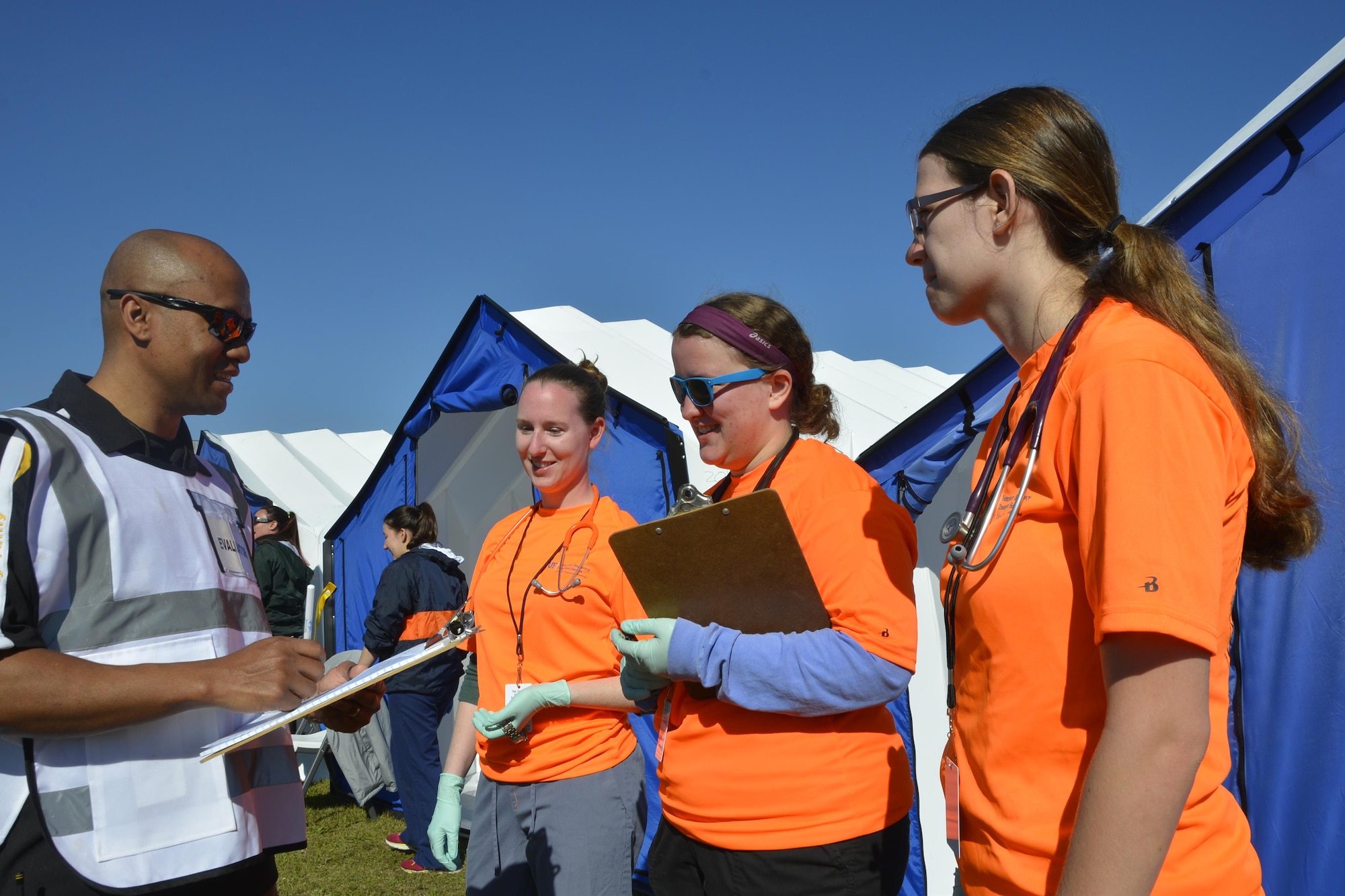 Maj. Lonnie Pirtle, Air Forces Northern Installation & Mission Support Division Readiness Section, talks with University of  Florida College of Veterinary Medicine students during an animal-related  disaster response workshop at the Bay County Fairgrounds Feb. 28. Hosted by the Florida State Agricultural Response Team and Bay County Emergency Services, the workshop focused on practicing providing disaster response assistance not only to people, but also animals. Pirtle was as an evaluator during the workshop. 