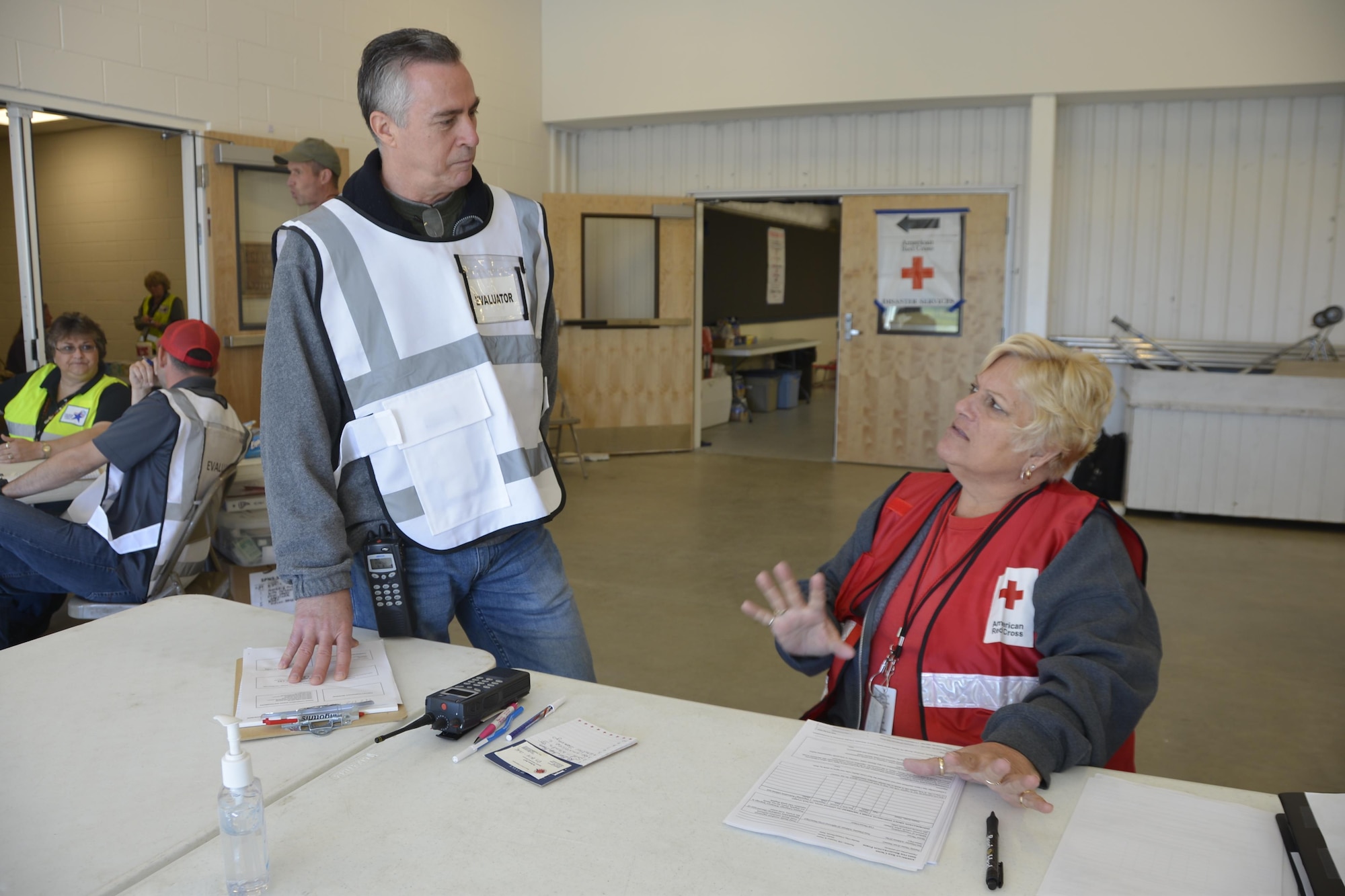 John Bender, Air Forces Northern Installation & Mission Support Division Readiness Section Chief, talks with Janis Pennell of the American Red Cross during an animal-related  disaster-response workshop at the Bay County Fairgrounds Feb. 28. Bender was an evaluator at the workshop. Hosted by the Florida State Agricultural Response Team and Bay County Emergency Services, the event brought together a wide variety of emergency-response agencies and focused on practicing providing disaster response assistance not only to people, but also their pets.