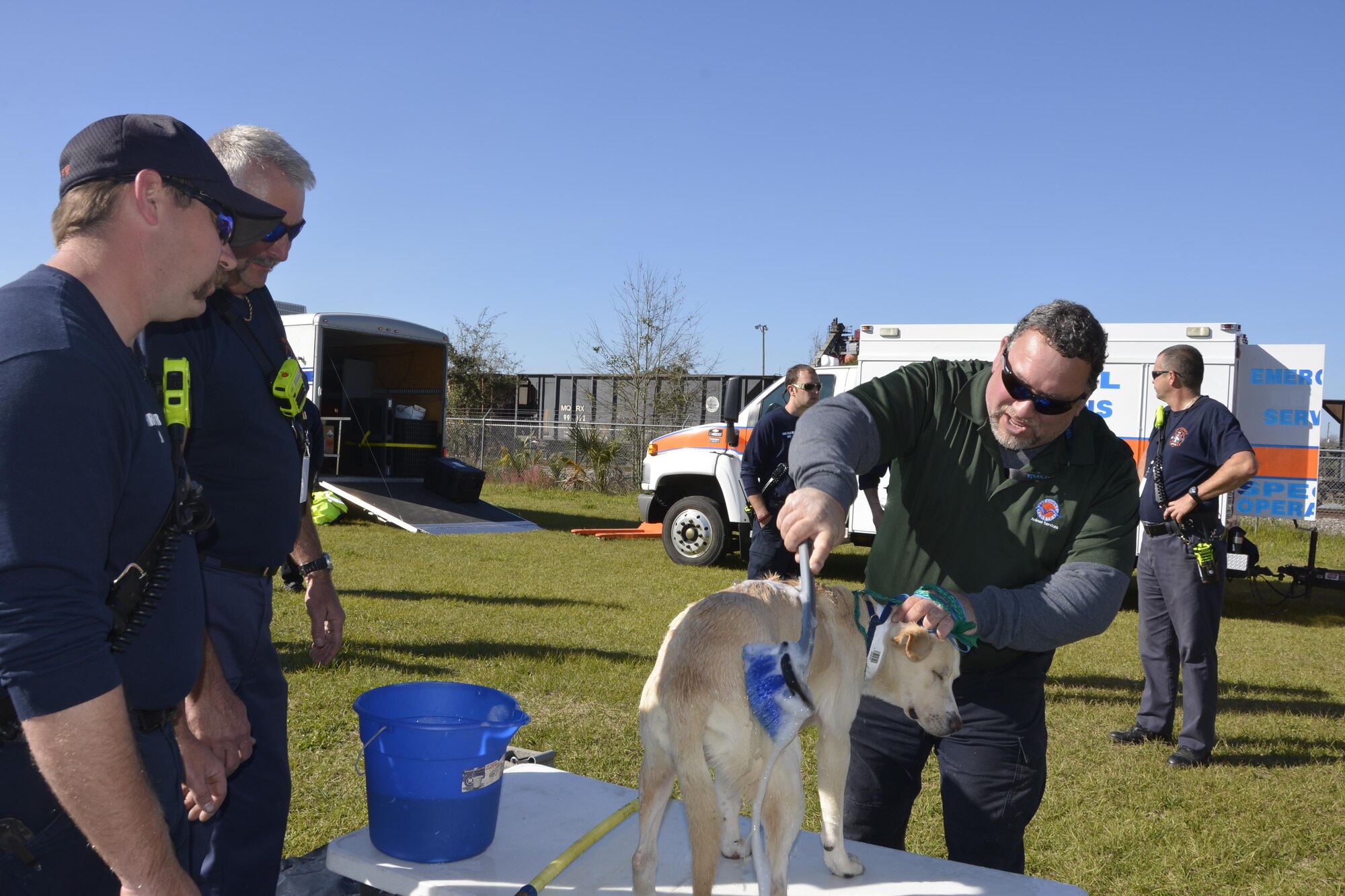 During an animal-related disaster-response workshop at the Bay County Fairgrounds Feb. 28, a Bay County Animal Services worker “decontaminates” a dog suspected of being exposed to “toxins” during the workshop scenario.  Hosted by the Florida State Agricultural Response Team and Bay County Emergency Services, the event brought together a wide variety of emergency-response agencies and focused on practicing providing disaster response assistance not only to people, but also animals.